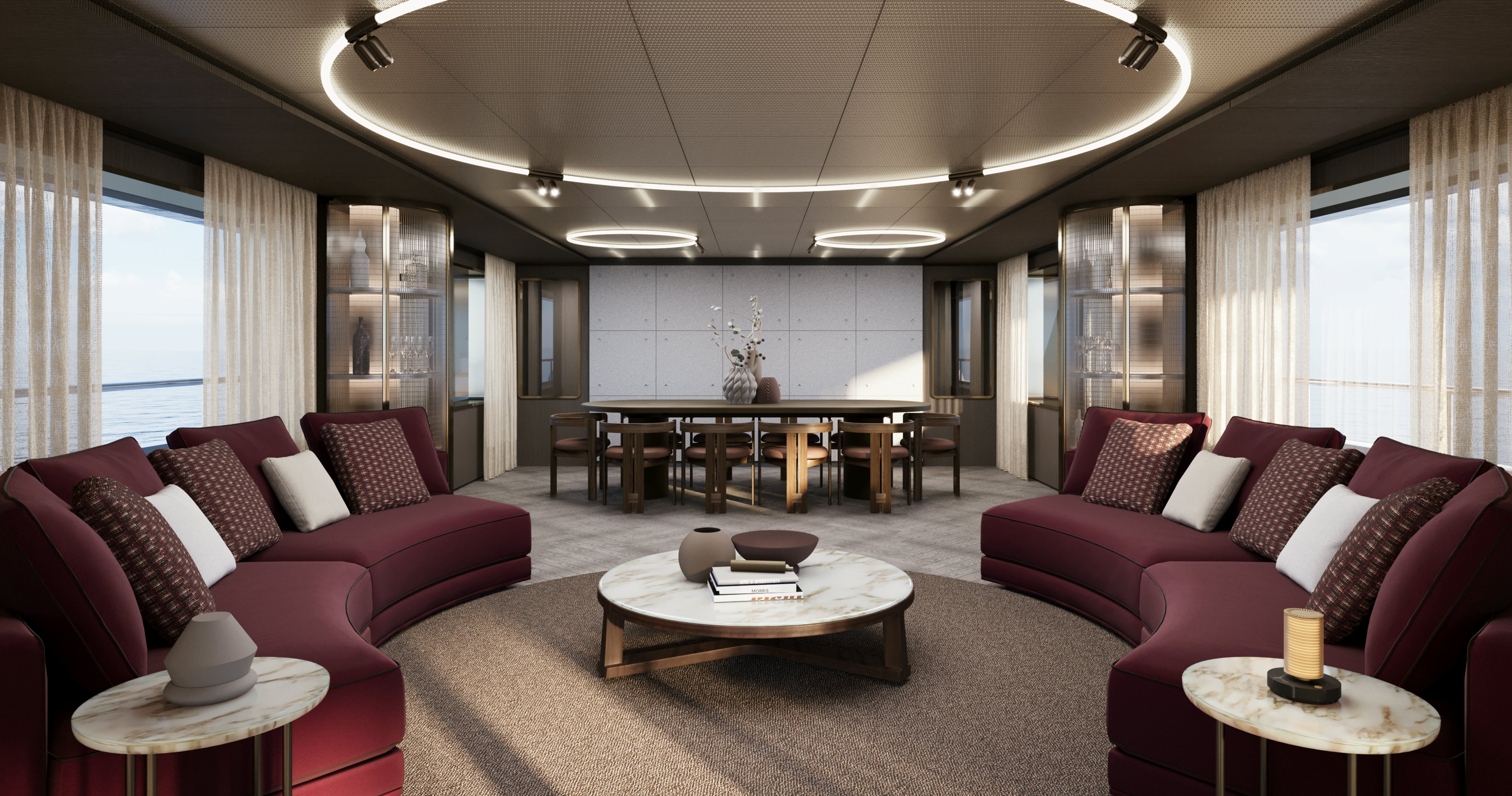 a living room with red couches aboard OCEAN KING EXPLORER 34M Yacht for Sale