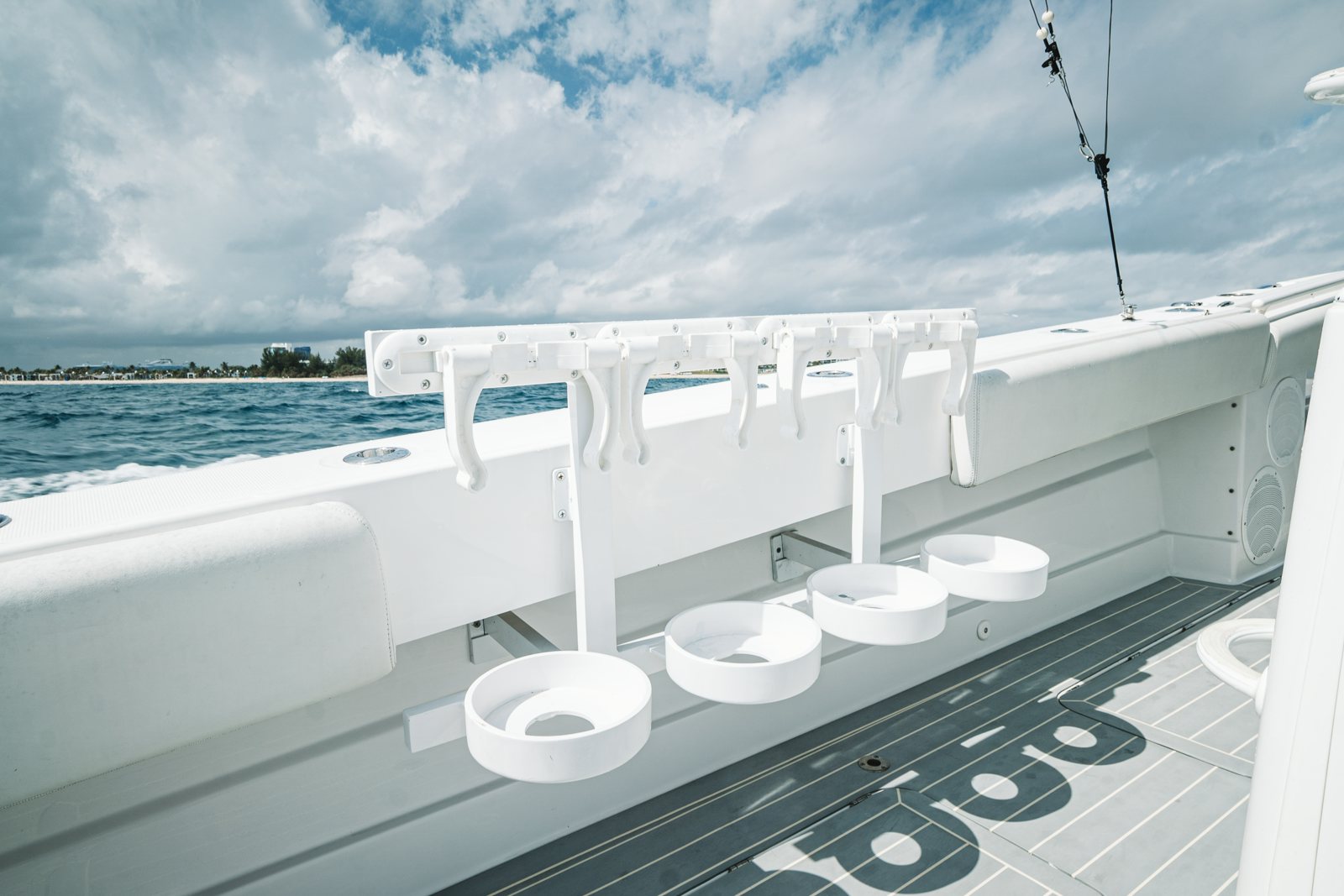 a white boat on a black and white surface next to a body of water aboard RELAPSE Yacht for Sale