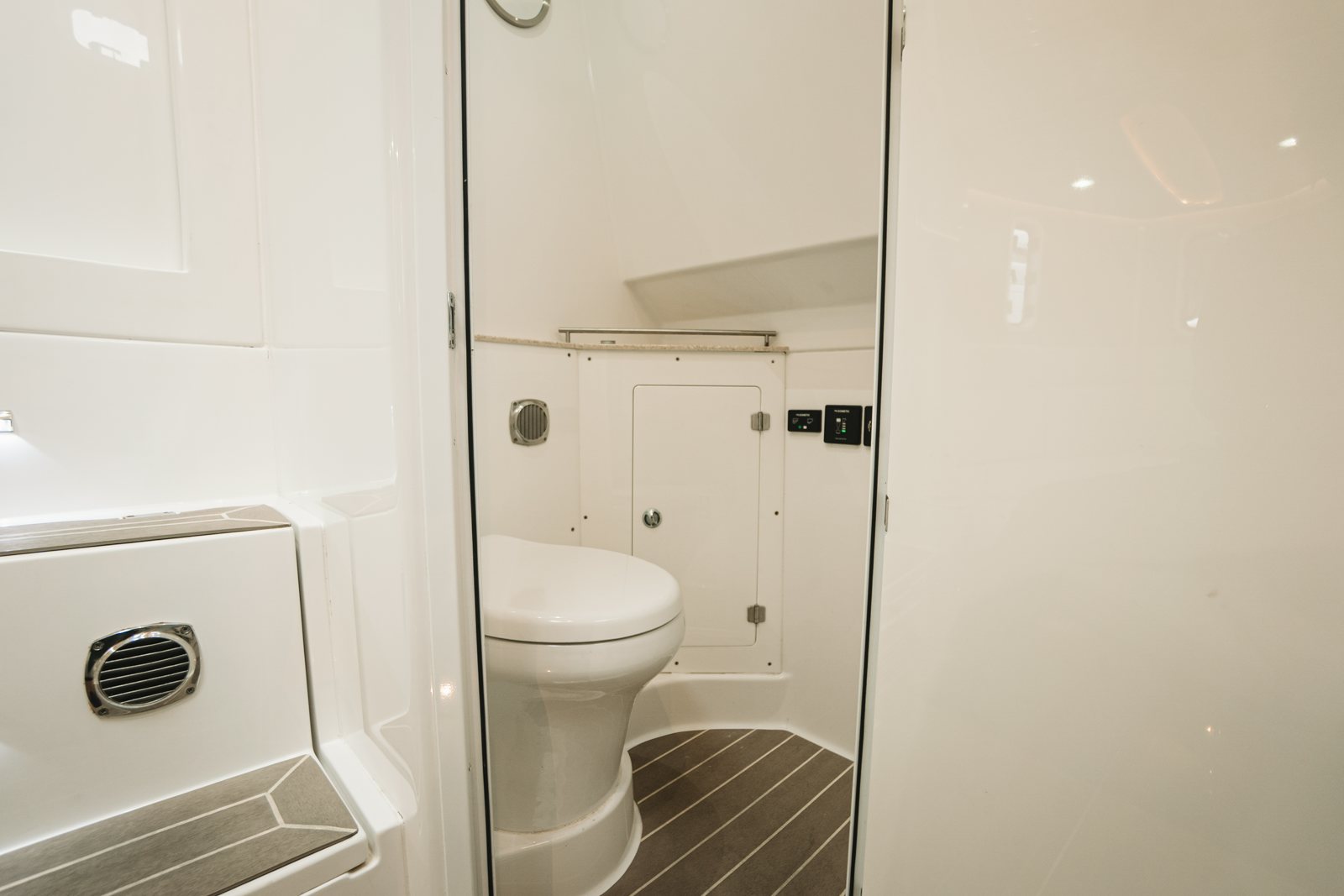 a bathroom with a toilet and washbasin aboard RELAPSE Yacht for Sale