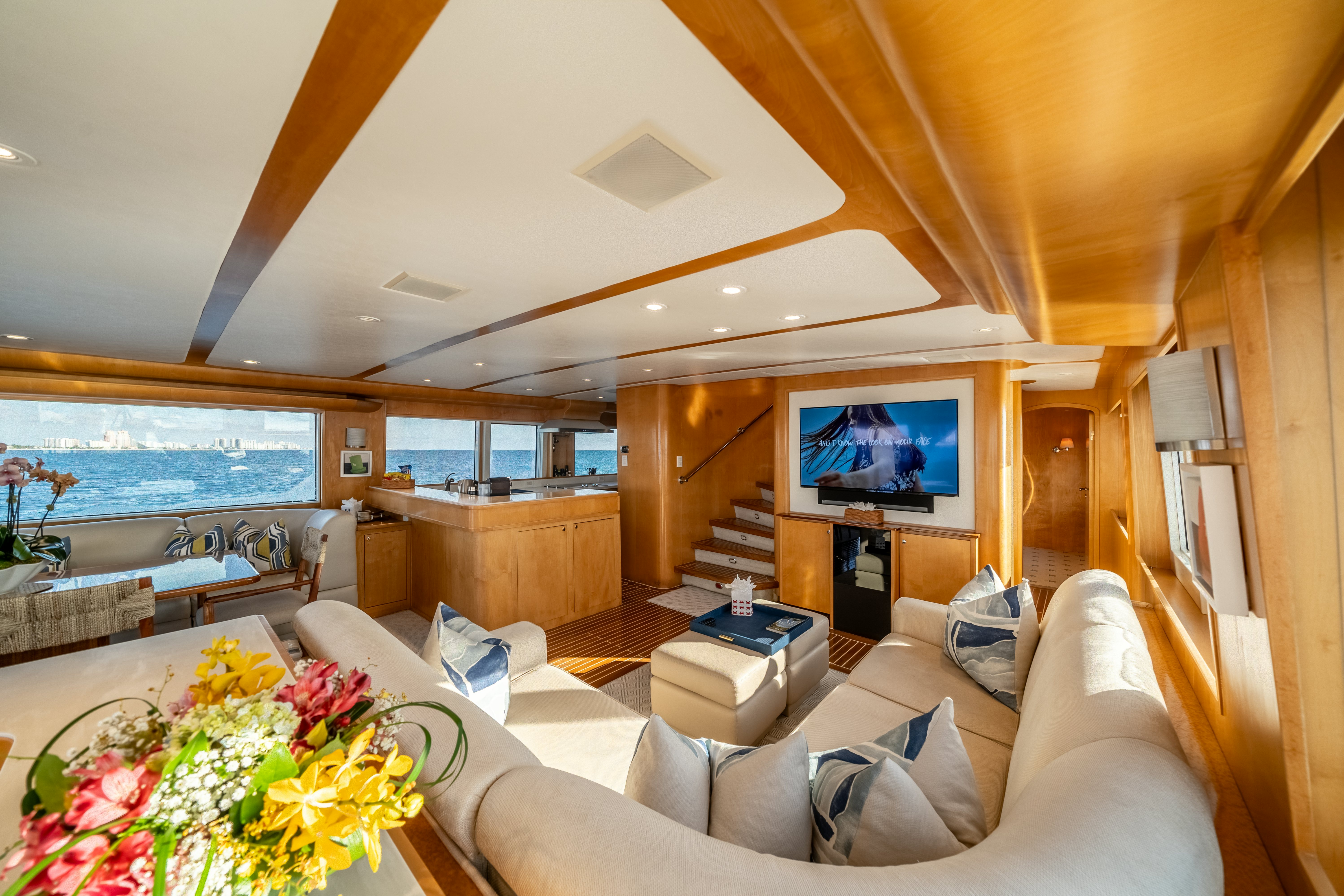 a living room with a large window aboard DESTINATION Yacht for Sale