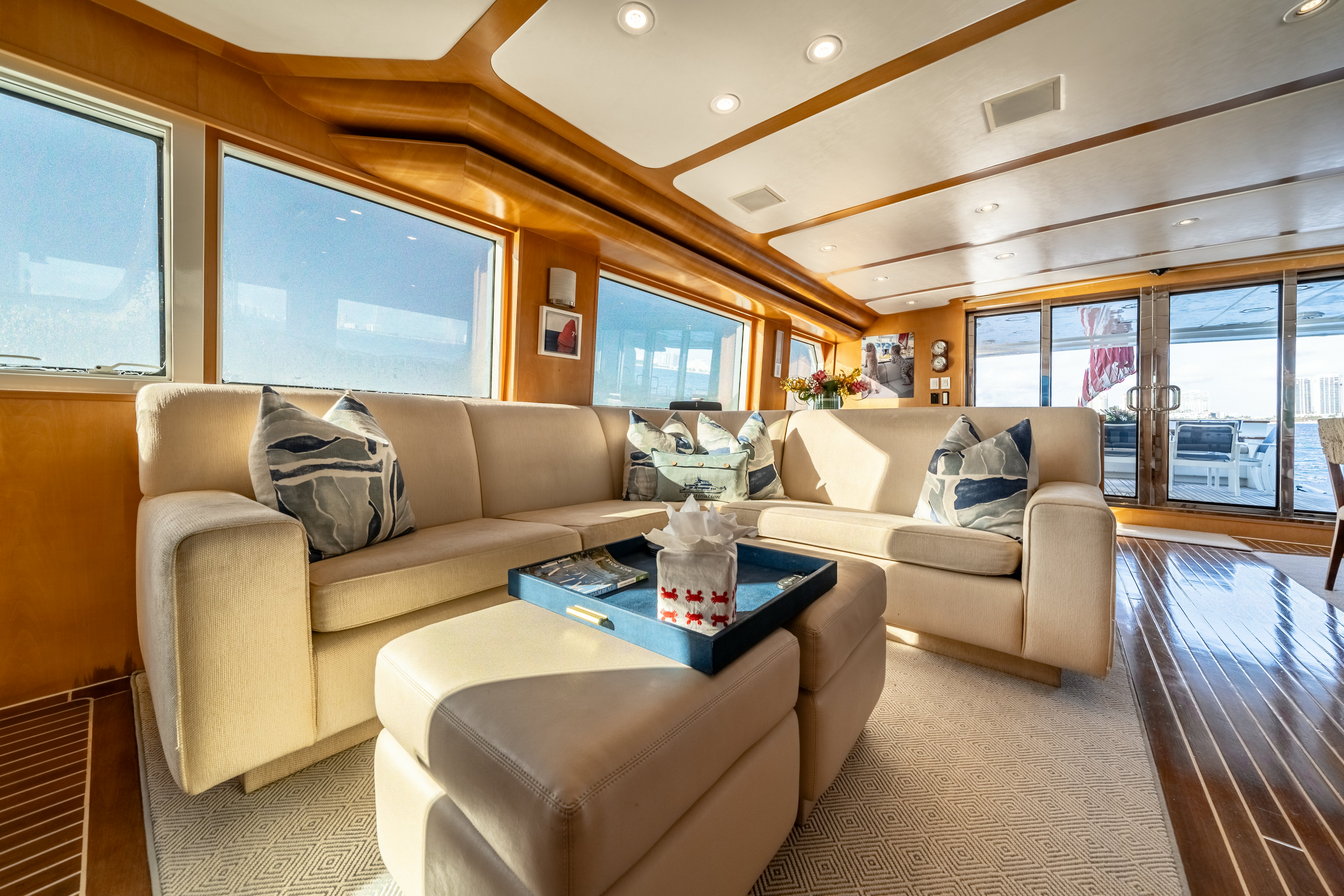 a living room with a couch and a coffee table aboard DESTINATION Yacht for Sale