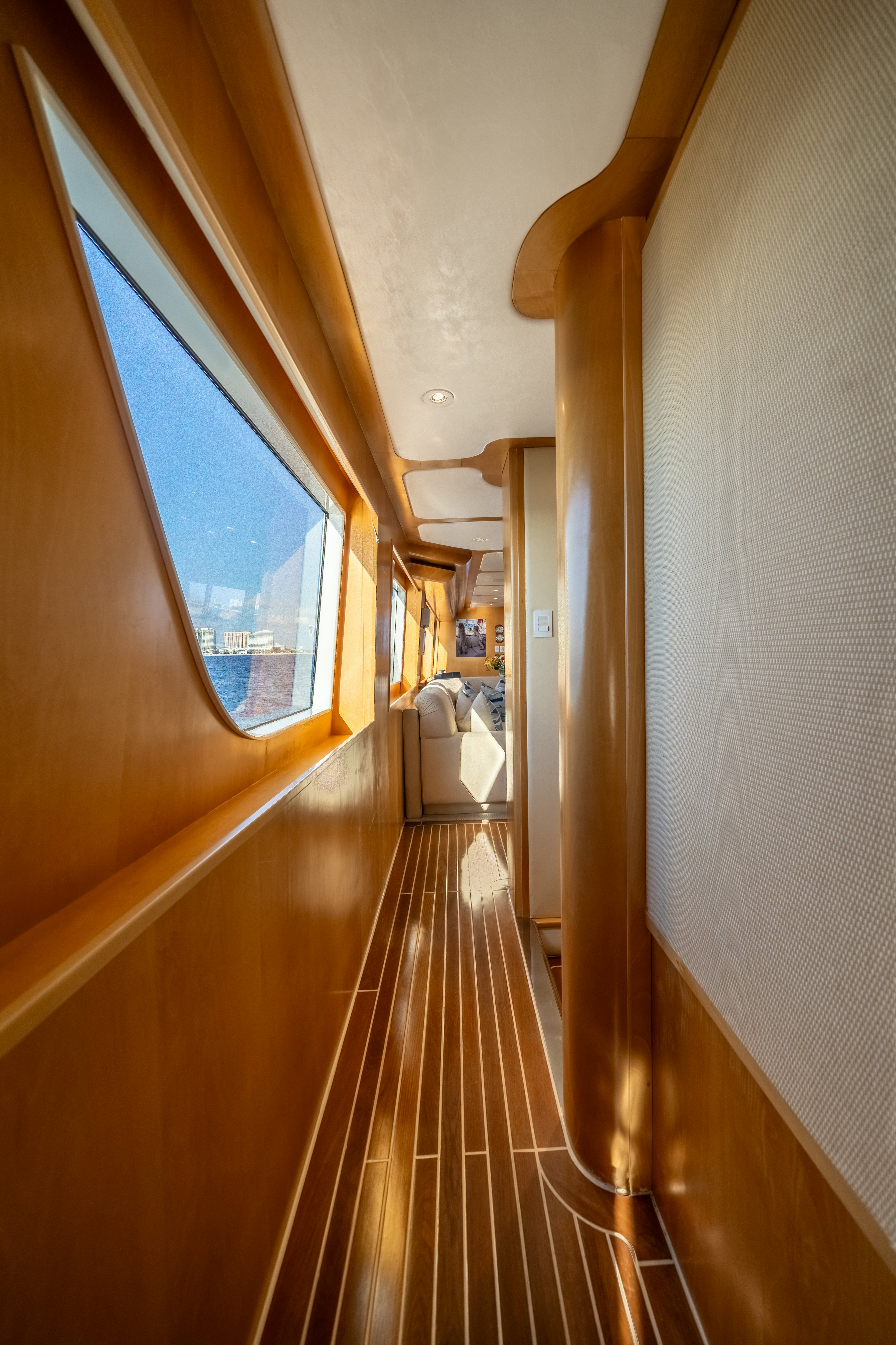 a long hallway with wood floors aboard DESTINATION Yacht for Sale