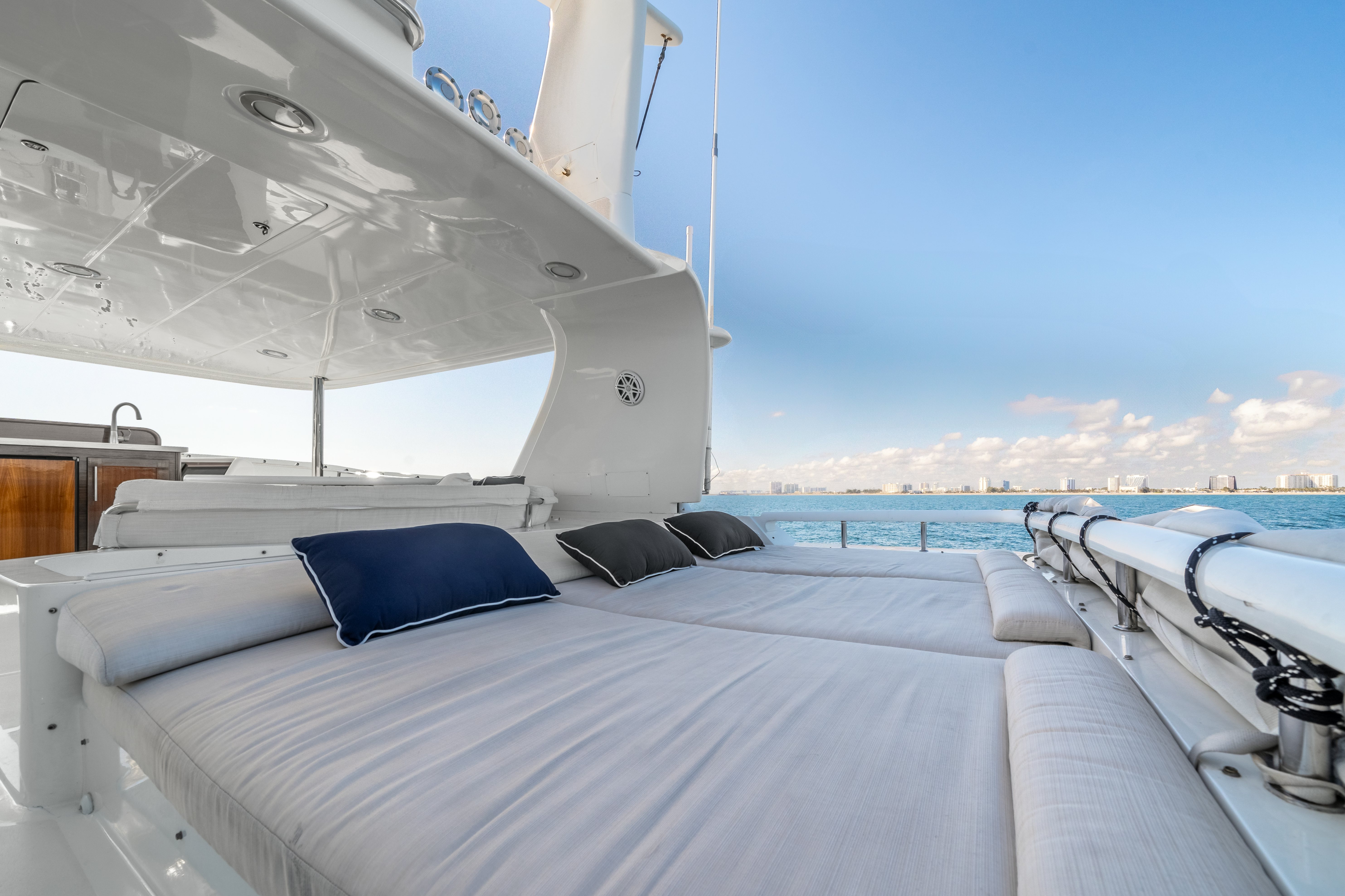 a room with a bed and a large window aboard DESTINATION Yacht for Sale