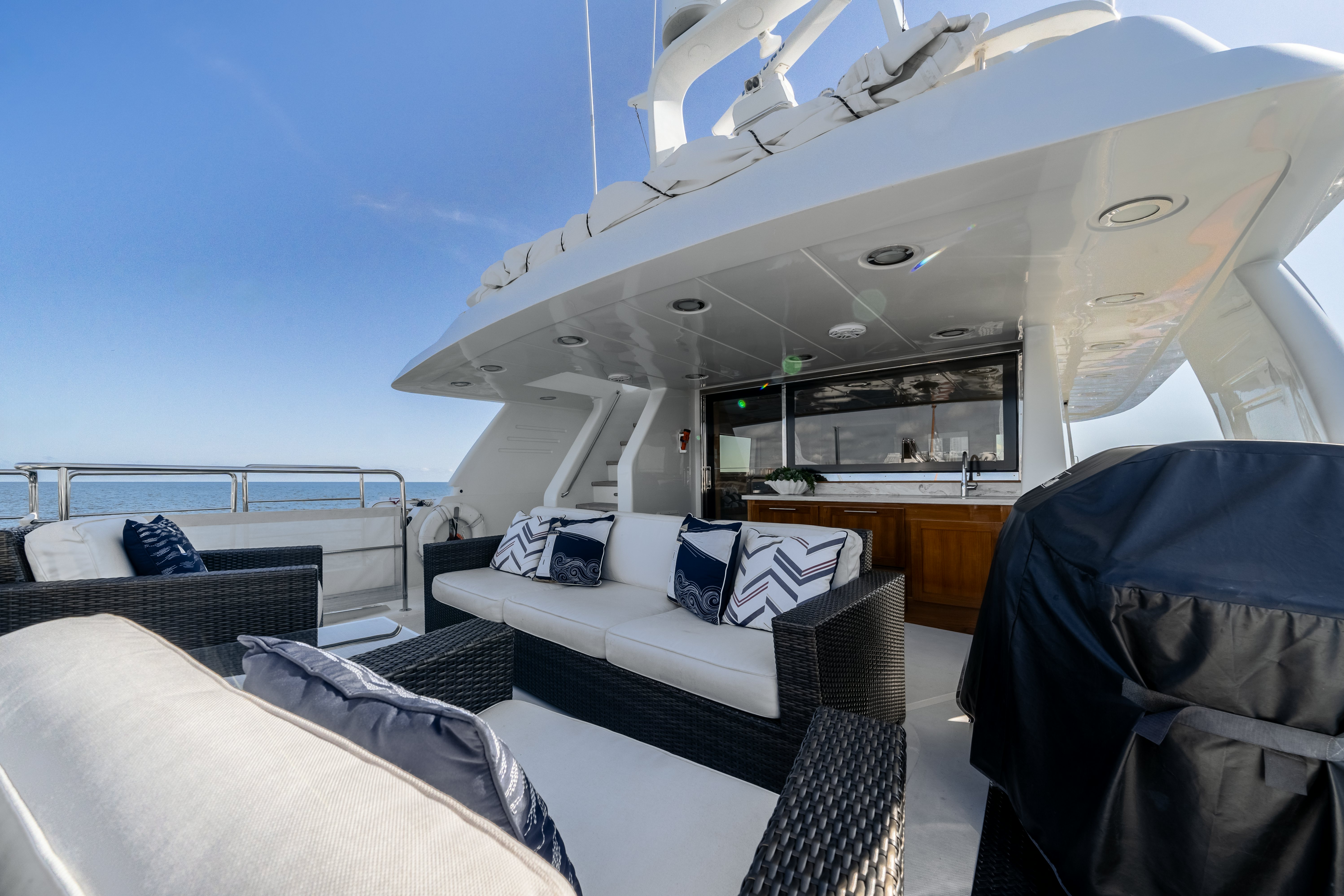 a room with a bed and a chair aboard DESTINATION Yacht for Sale