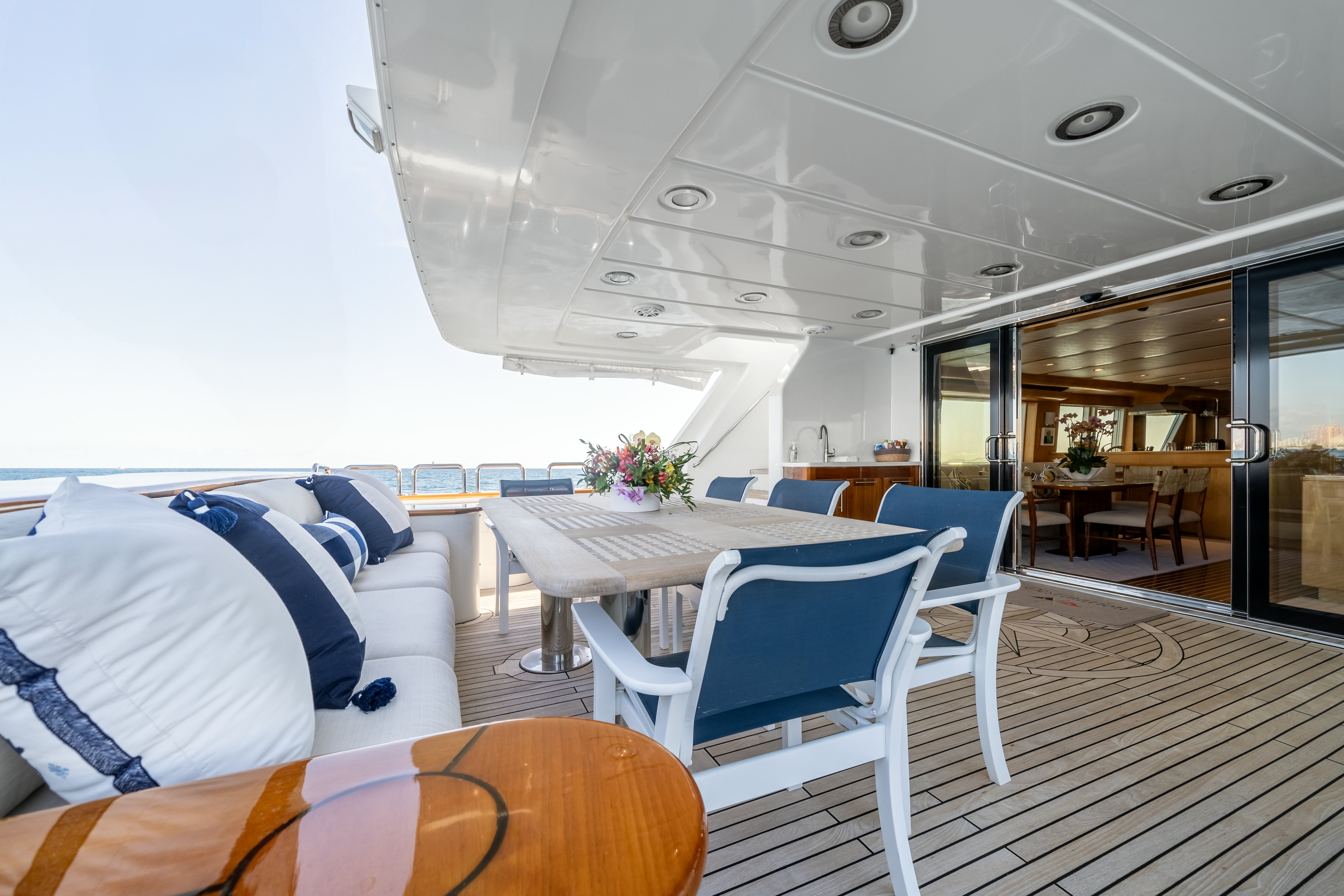 a room with a table and chairs aboard DESTINATION Yacht for Sale