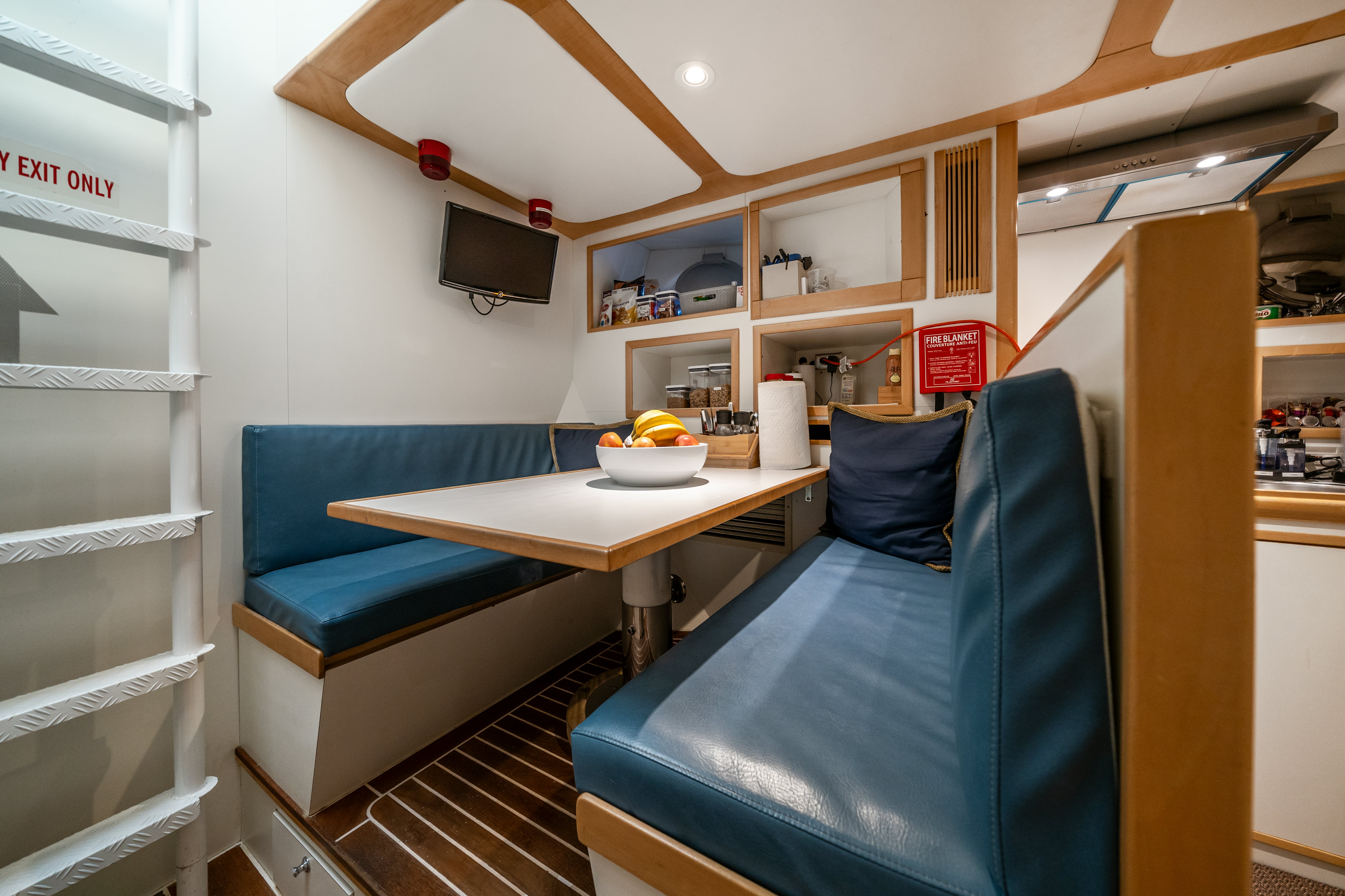 a room with a couch and a table aboard DESTINATION Yacht for Sale