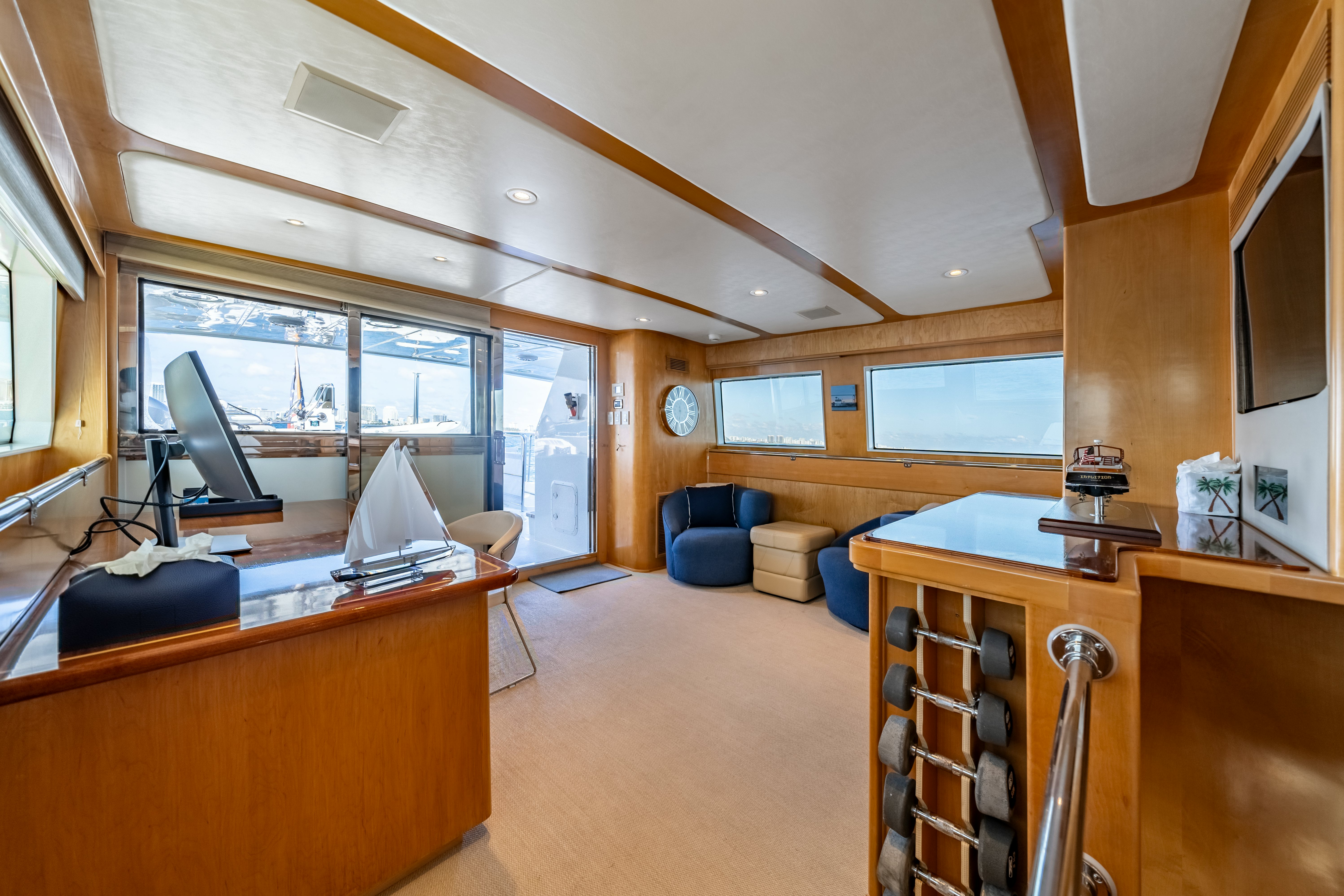 a room with a desk and a computer aboard DESTINATION Yacht for Sale