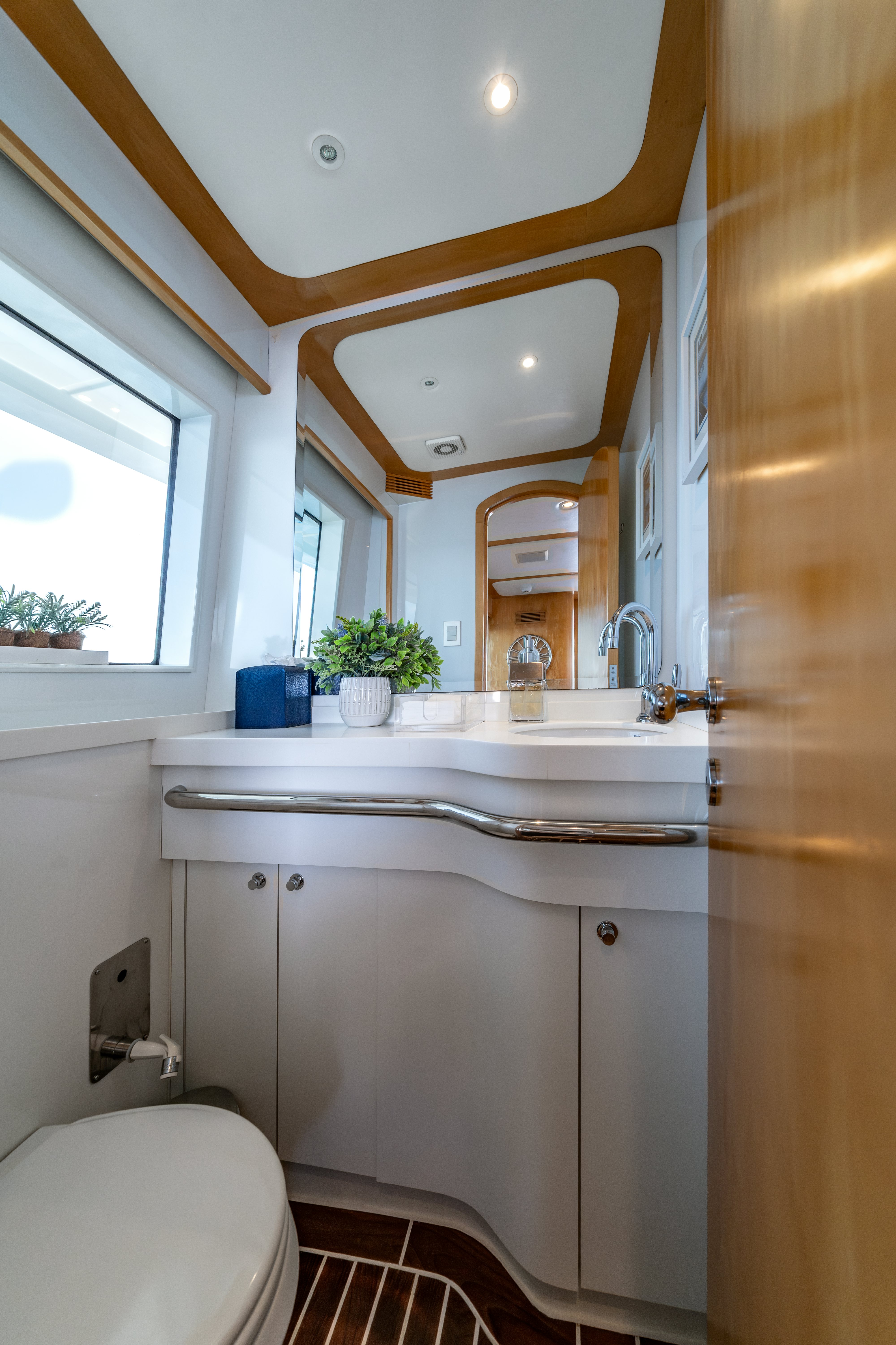 a bathroom with a sink and a toilet aboard DESTINATION Yacht for Sale