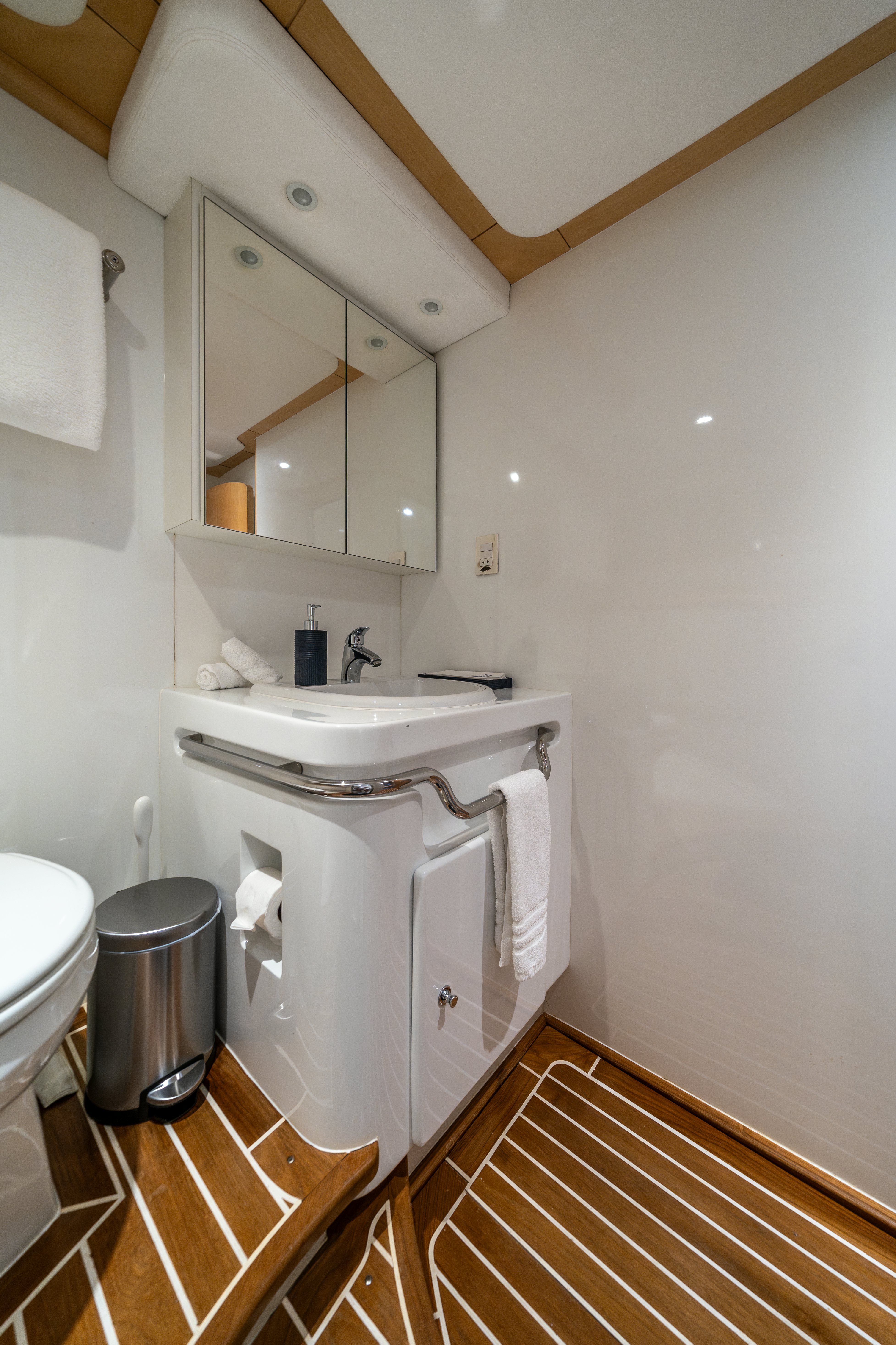 a bathroom with a sink and a mirror aboard DESTINATION Yacht for Sale