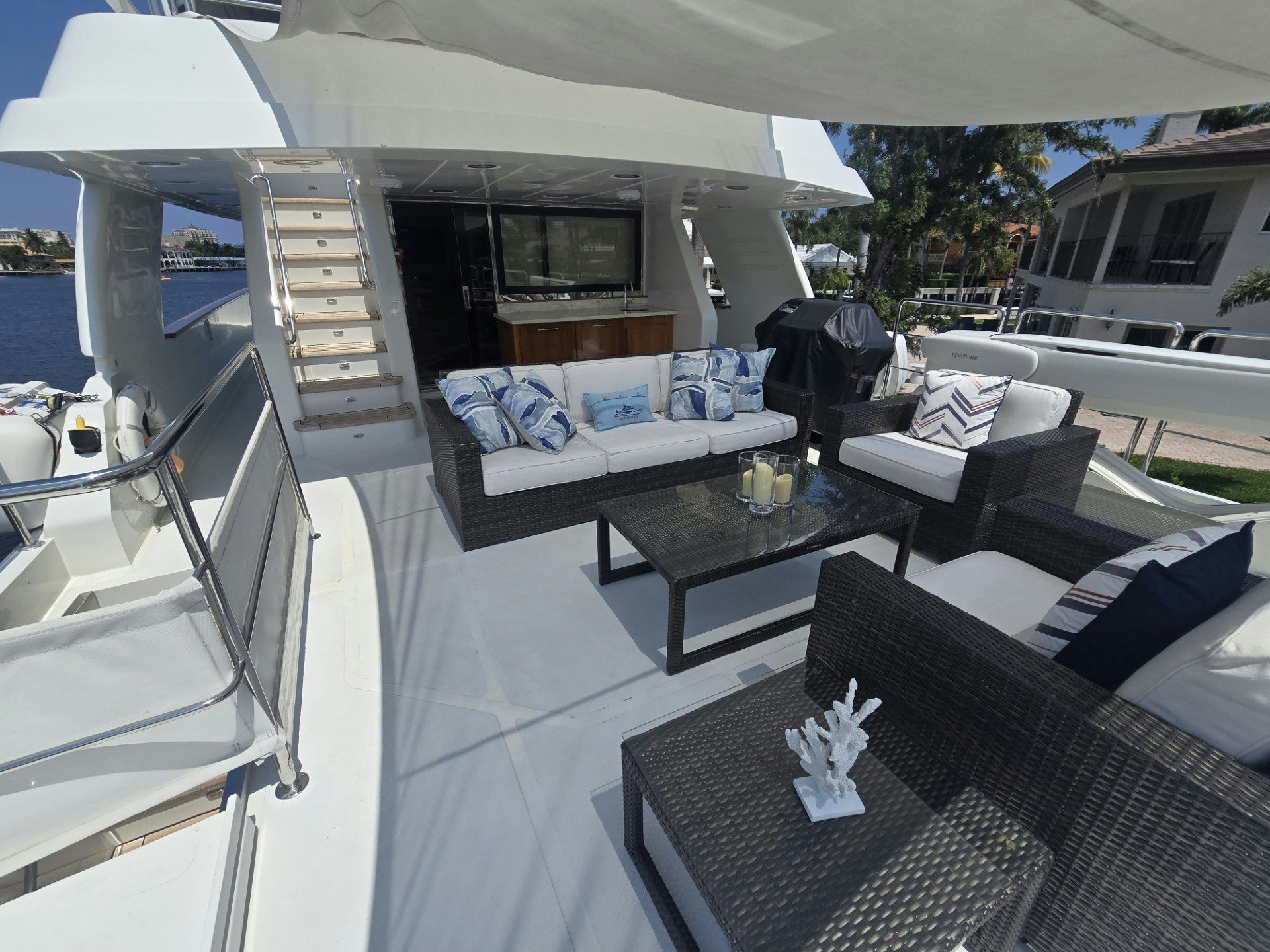 a living room with a large patio aboard DESTINATION Yacht for Sale