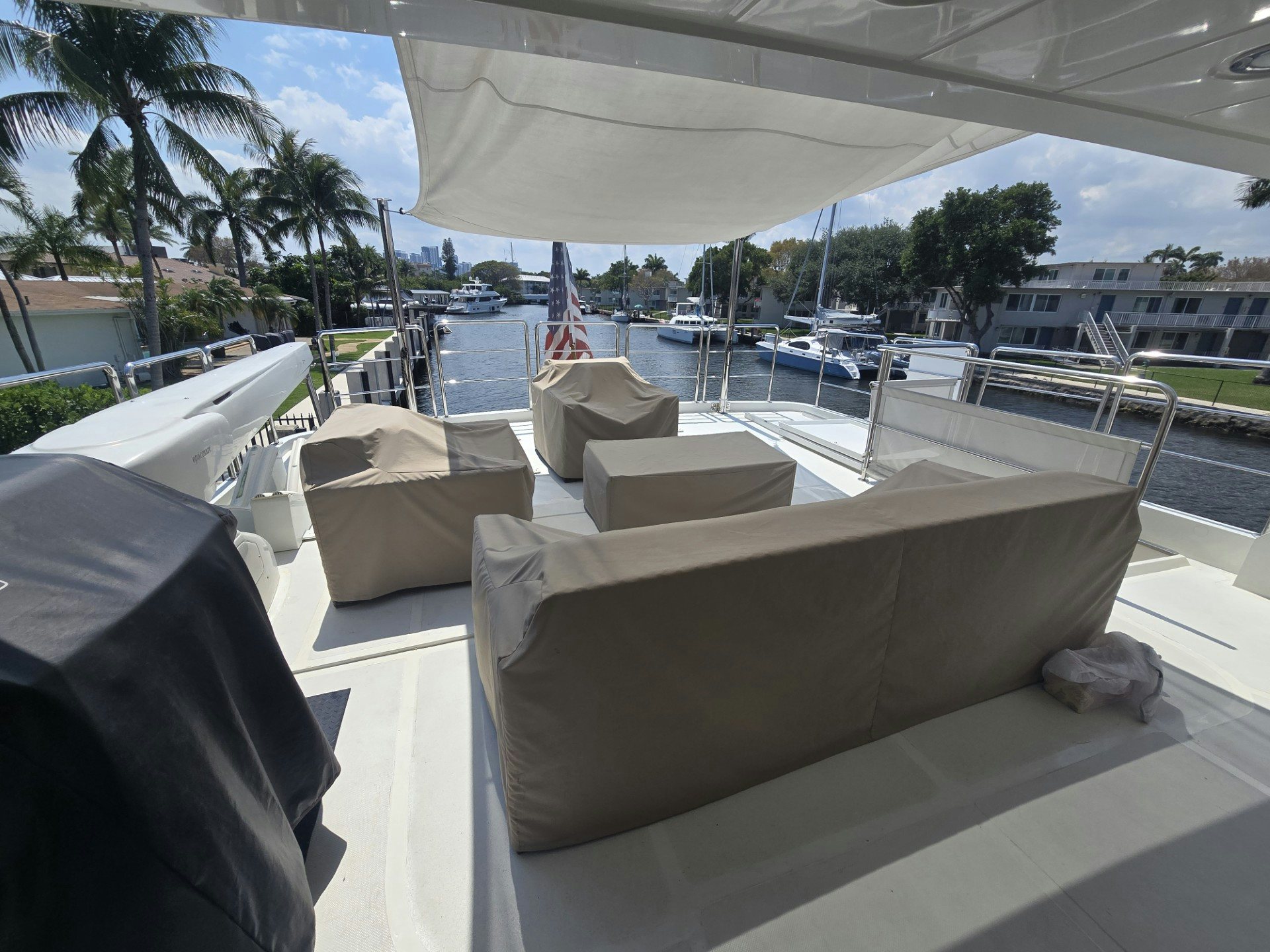a lounge area with a lounge chair and a body of water aboard DESTINATION Yacht for Sale