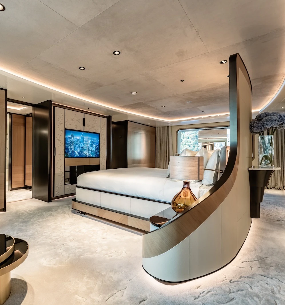 a large room with a bed and a tv aboard AFTER YOU Yacht for Charter