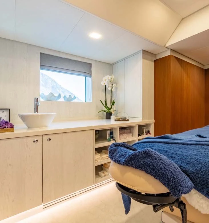 a kitchen with a chair and a sink aboard AFTER YOU Yacht for Charter