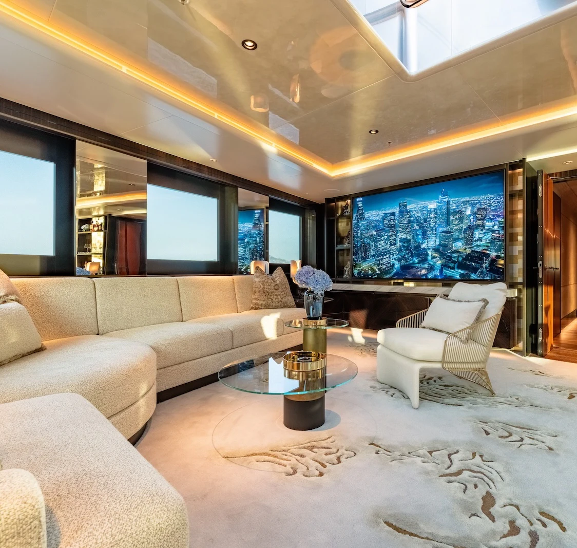a living room with a large sofa aboard AFTER YOU Yacht for Charter