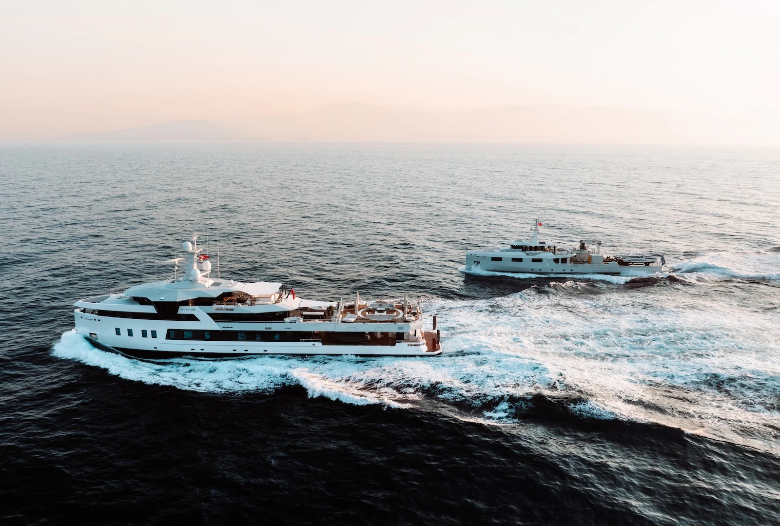 a couple of boats in the ocean aboard AFTER YOU Yacht for Charter