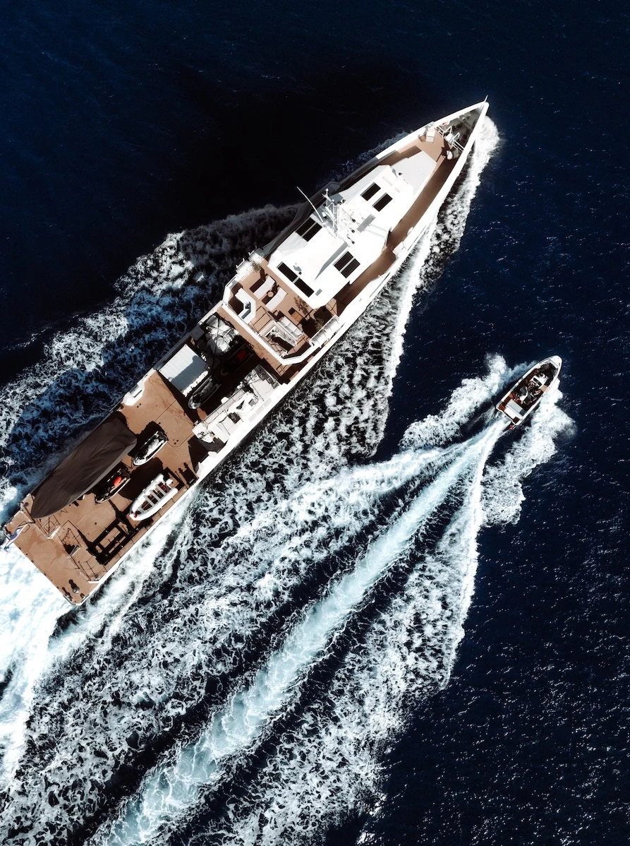 a large white building with a red roof and a large white tower aboard AFTER YOU Yacht for Charter