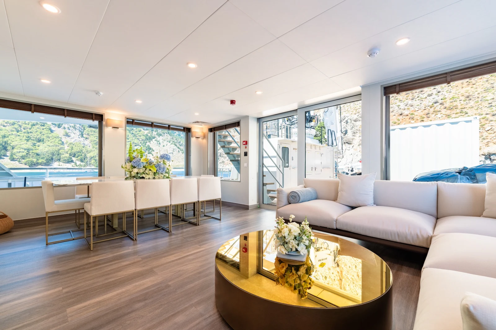 a living room with a large window aboard AFTER YOU Yacht for Charter