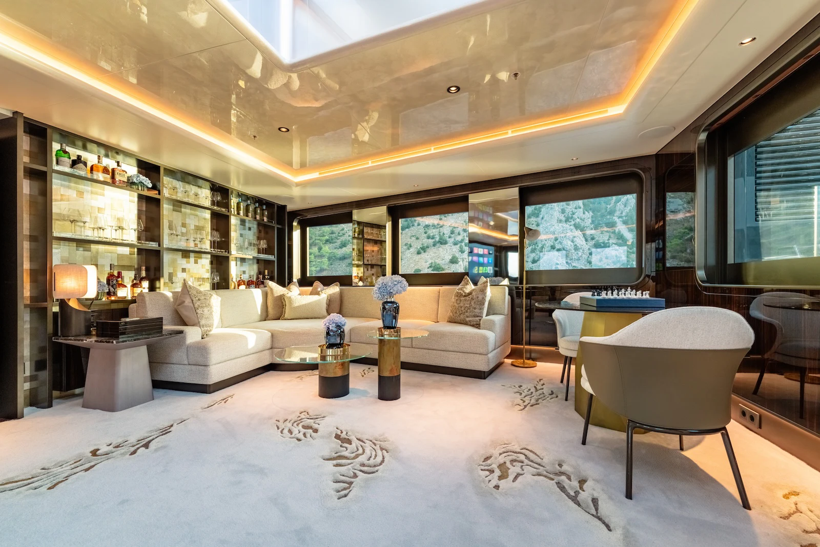 a living room with a couch and a table aboard AFTER YOU Yacht for Charter