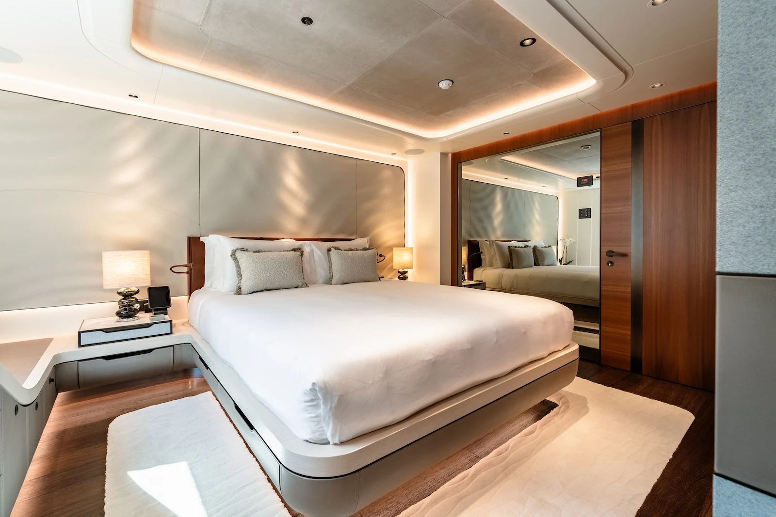 a bedroom with a bed and a desk aboard AFTER YOU Yacht for Charter