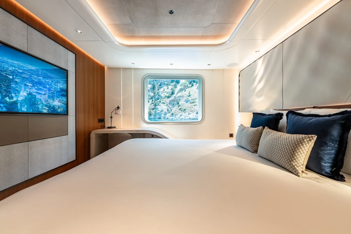 a bed with a white sheet aboard AFTER YOU Yacht for Charter