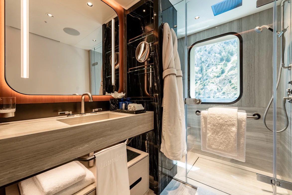 a bathroom with a large mirror aboard AFTER YOU Yacht for Charter