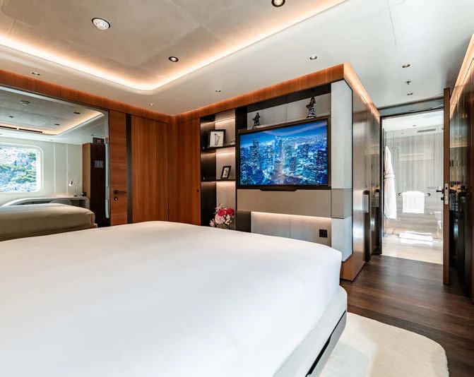 a bedroom with a large tv aboard AFTER YOU Yacht for Charter