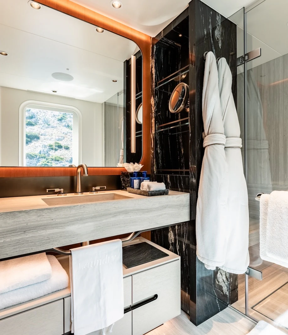 a bathroom with a sink and towels aboard AFTER YOU Yacht for Charter