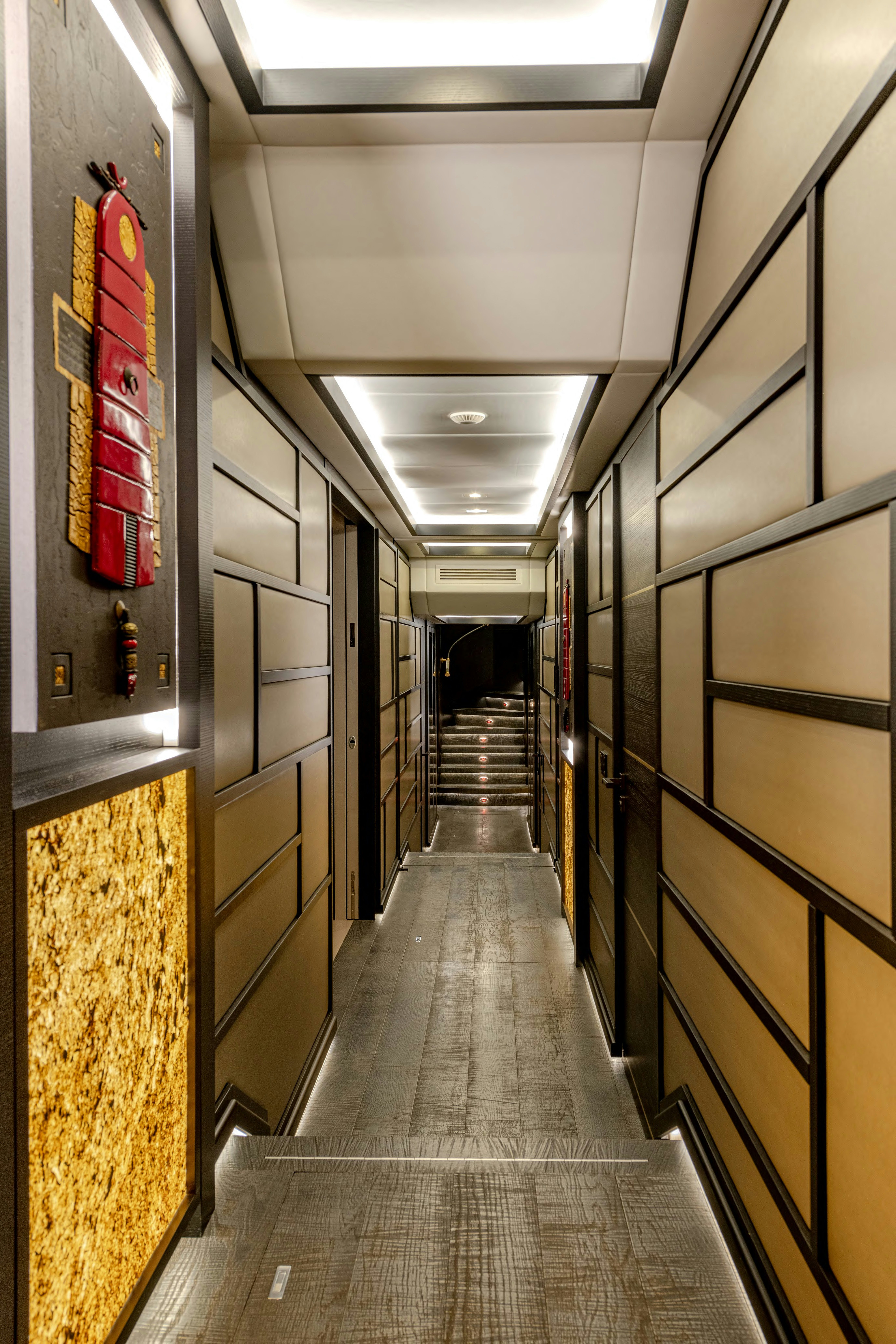 a hallway with a red sign aboard BLACK LEGEND Yacht for Sale