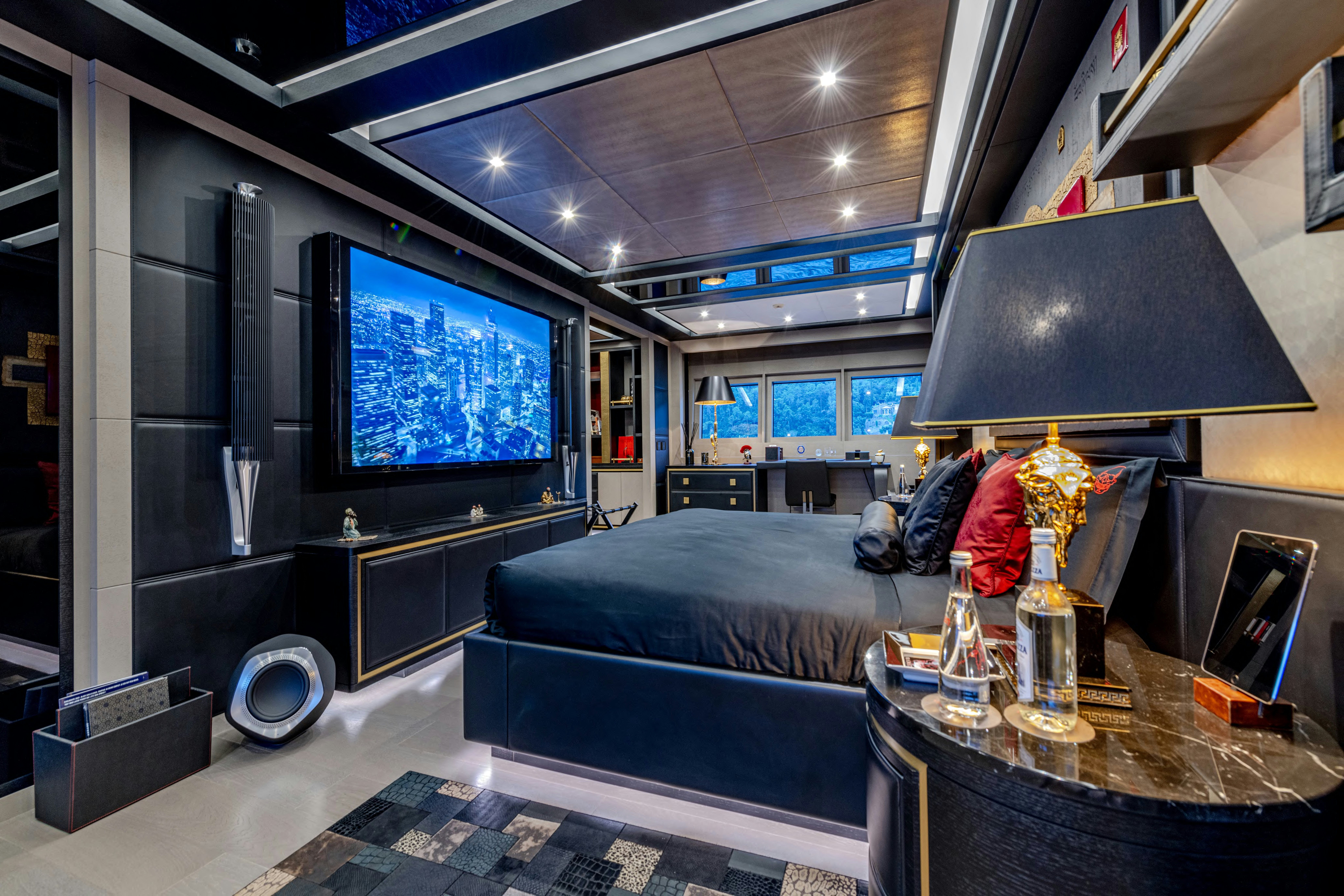 a living room with a large television aboard BLACK LEGEND Yacht for Sale