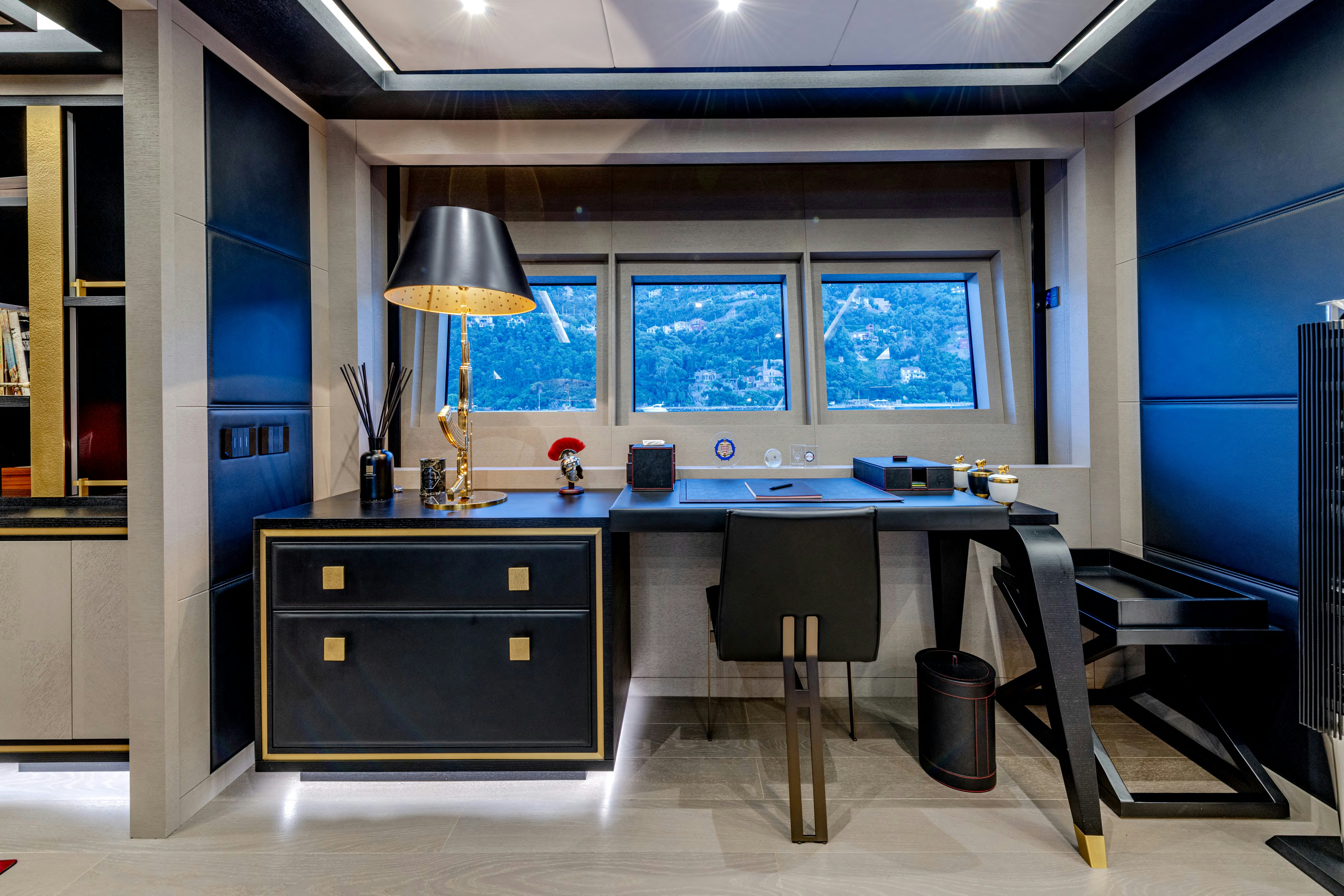 a room with a table and chairs aboard BLACK LEGEND Yacht for Sale