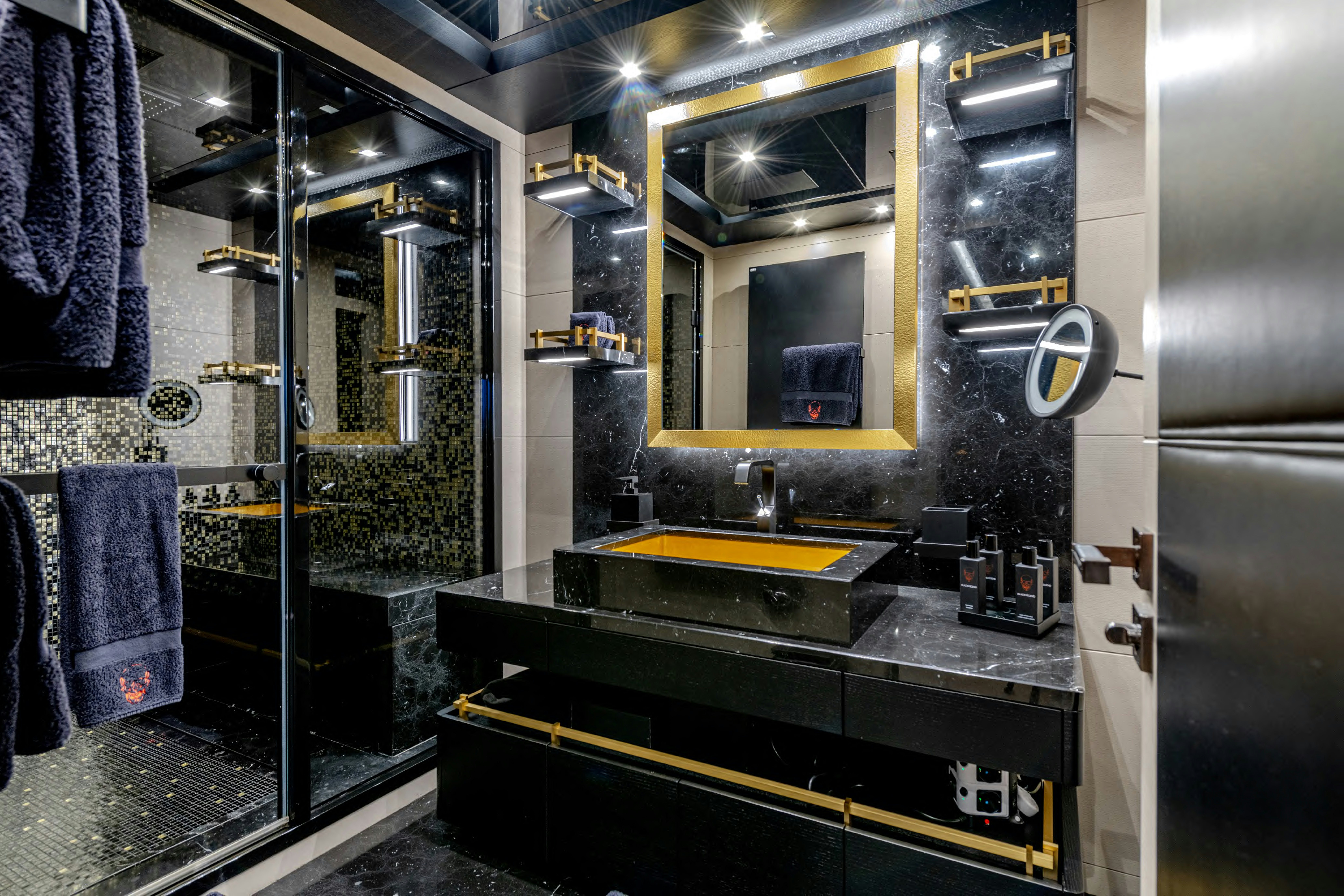 a bathroom with a large mirror aboard BLACK LEGEND Yacht for Sale