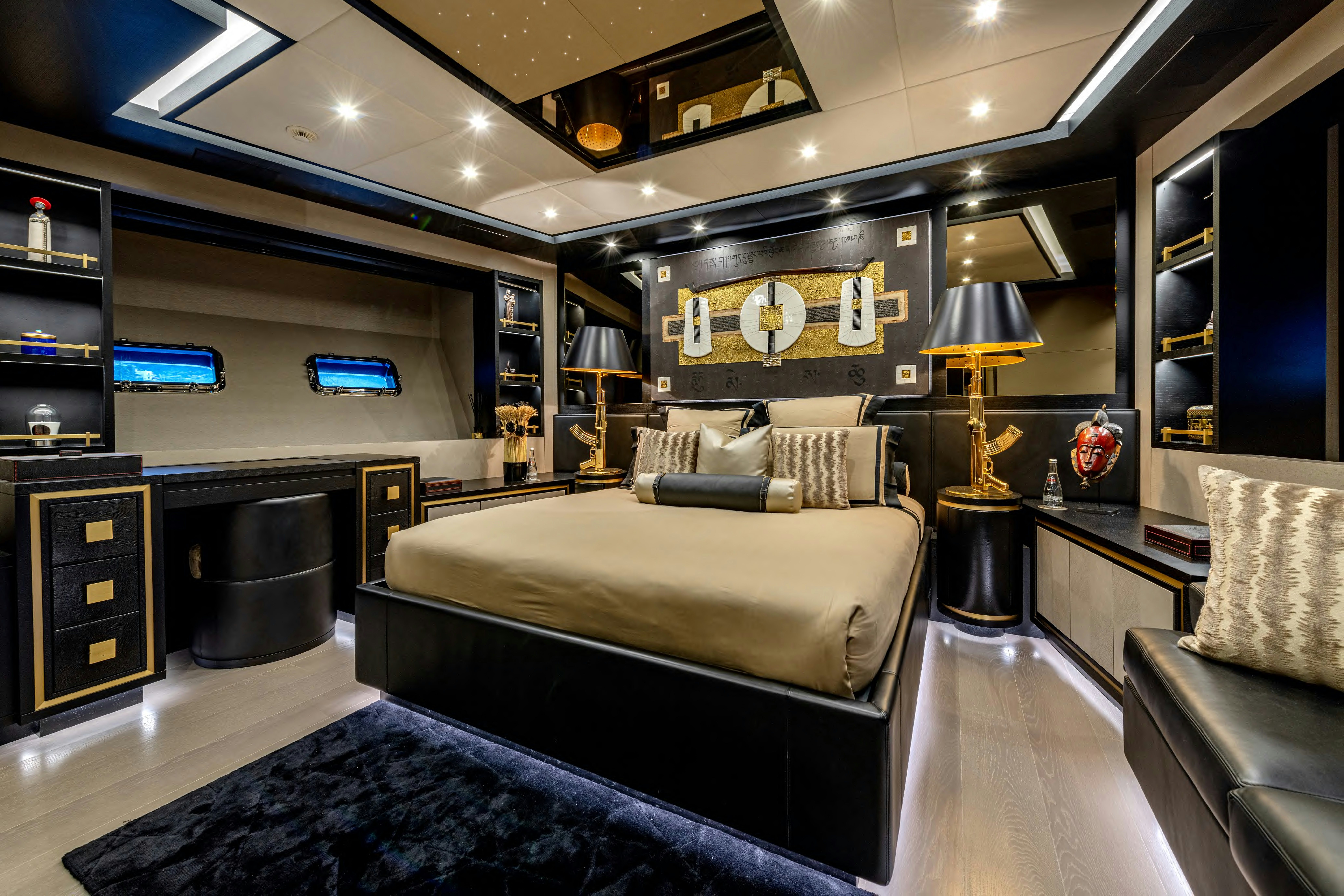 a room with a bed and a couch aboard BLACK LEGEND Yacht for Sale