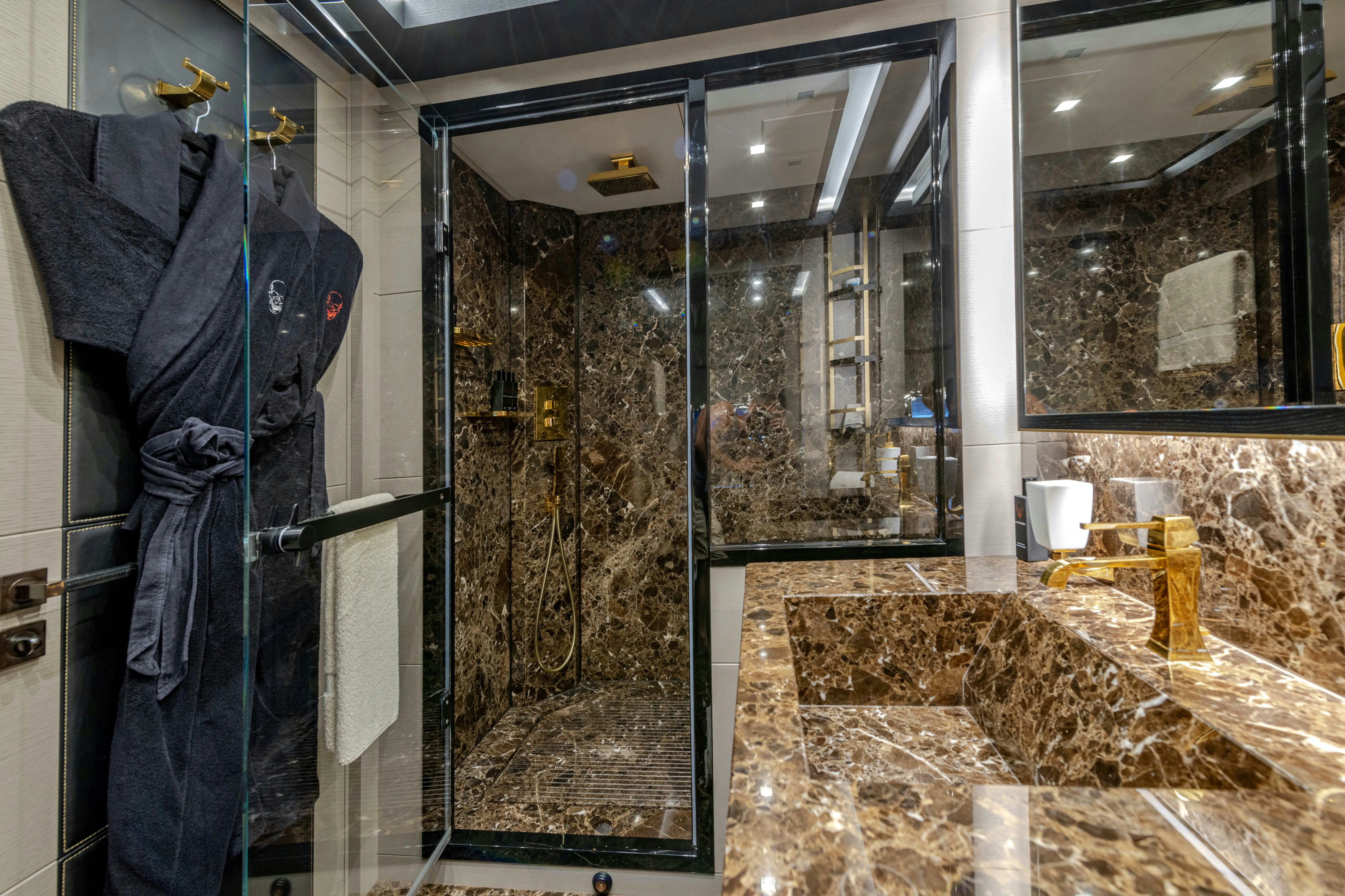 a large bathroom with a large marble counter top aboard BLACK LEGEND Yacht for Sale