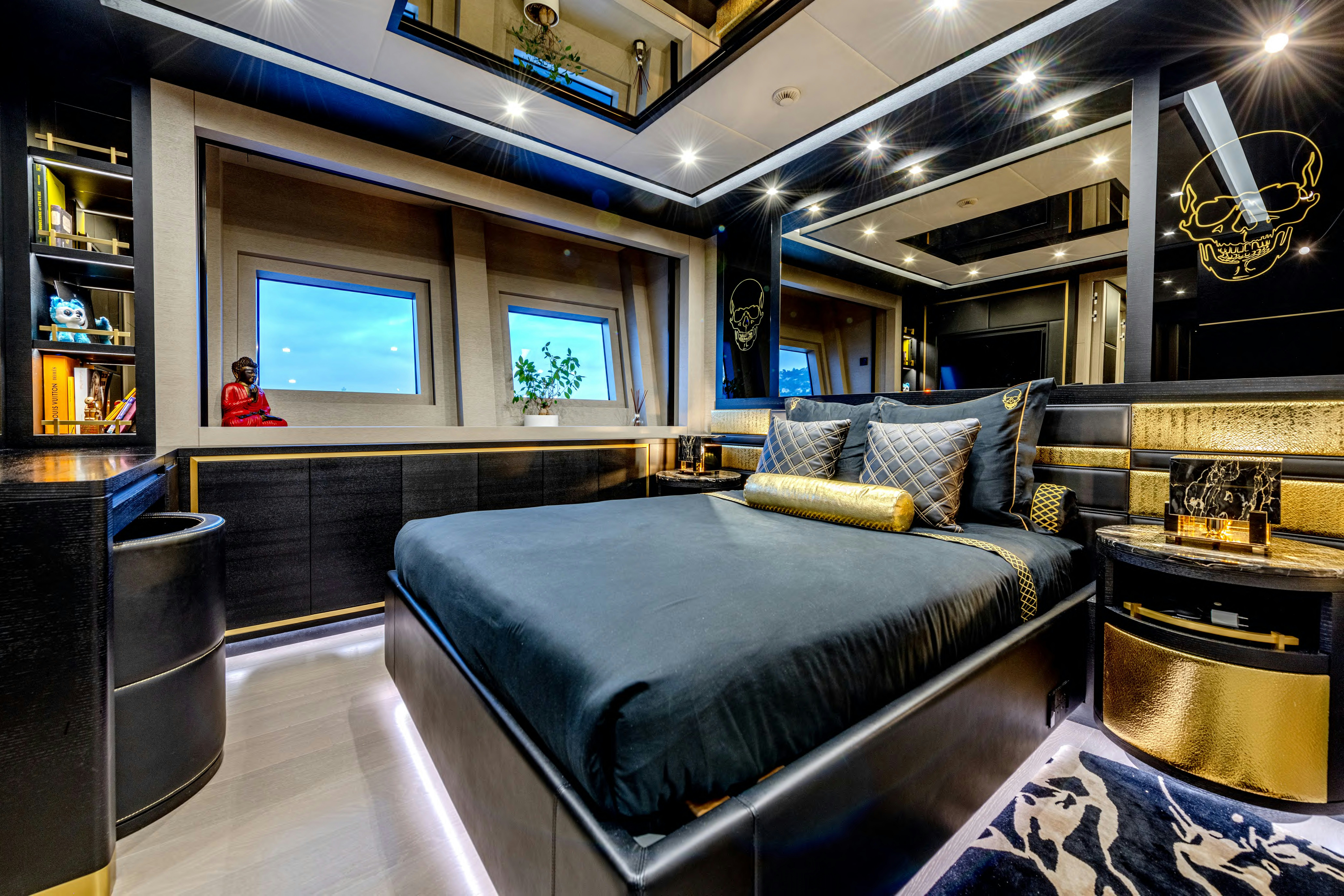 a bedroom with a large bed aboard BLACK LEGEND Yacht for Sale