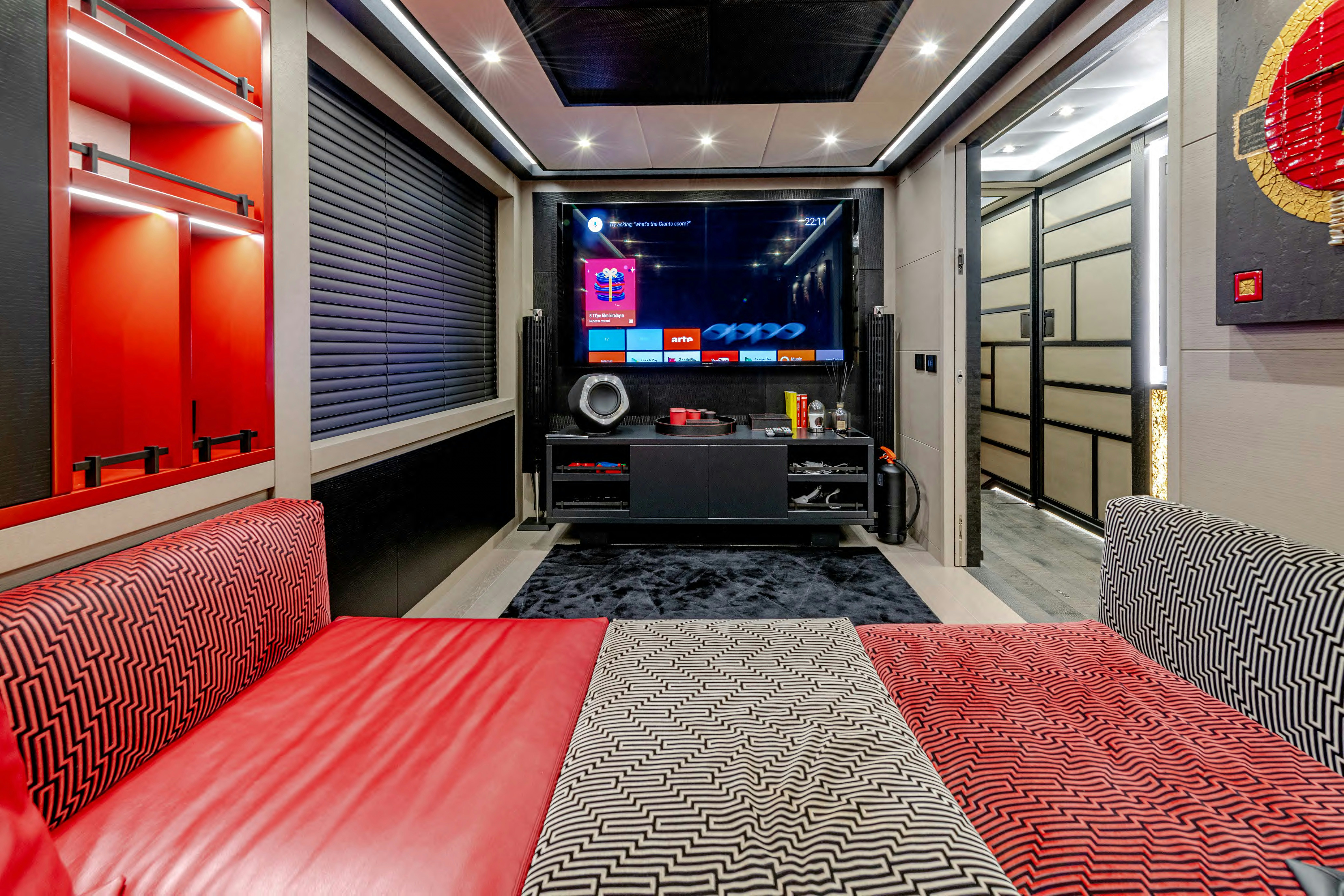 a room with a table and a tv aboard BLACK LEGEND Yacht for Sale