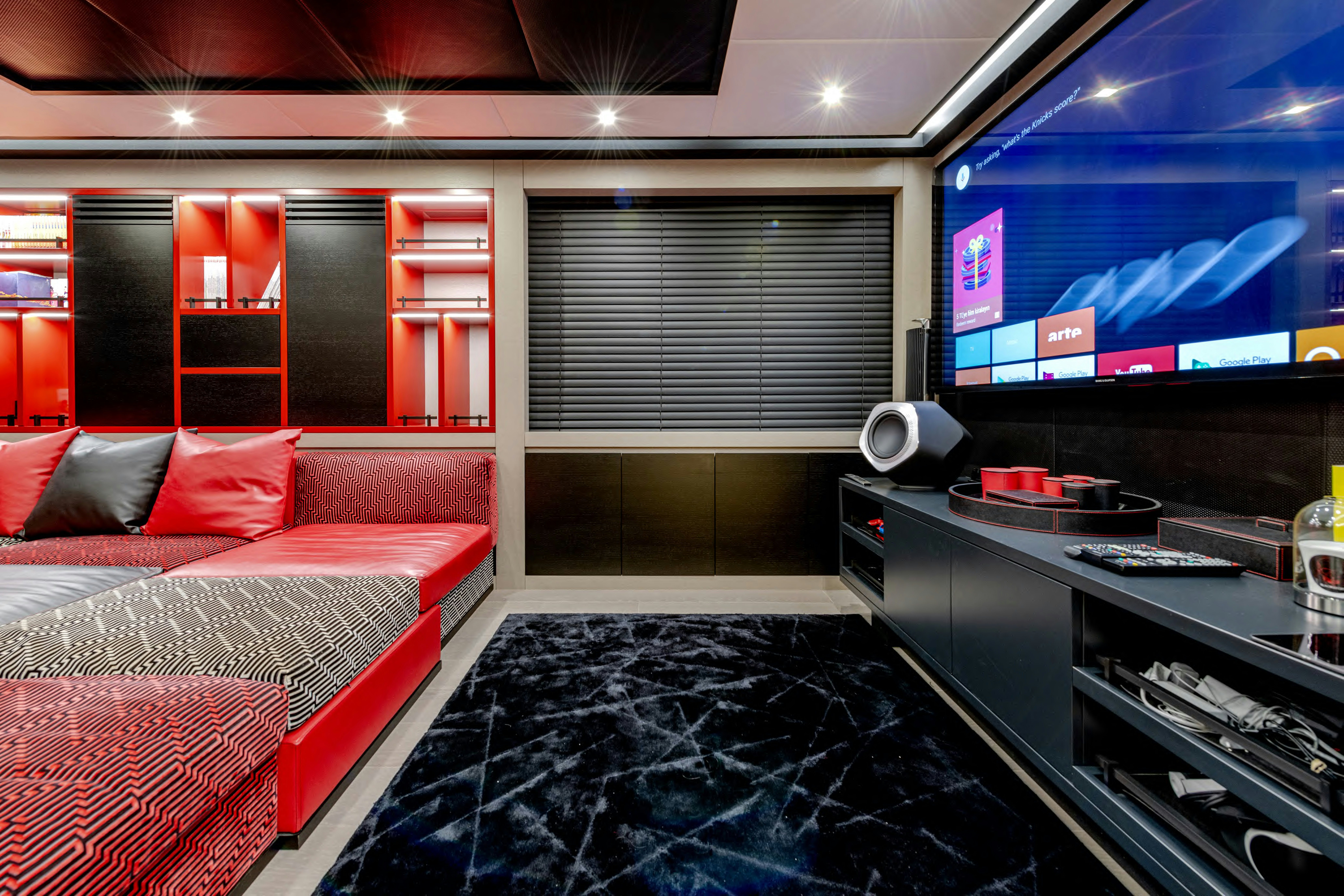 a room with red and white beds aboard BLACK LEGEND Yacht for Sale