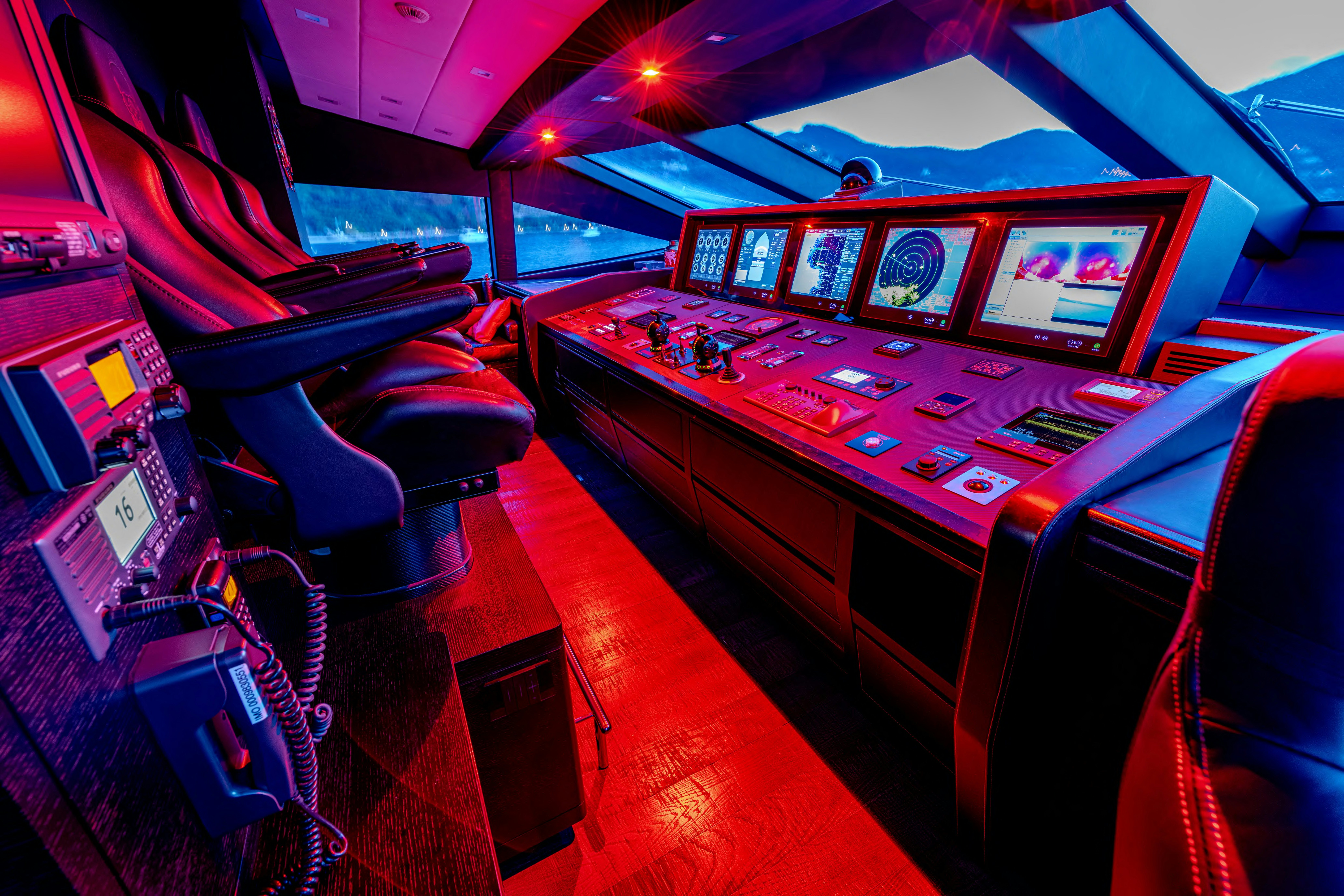 a large room with a large table and chairs aboard BLACK LEGEND Yacht for Sale