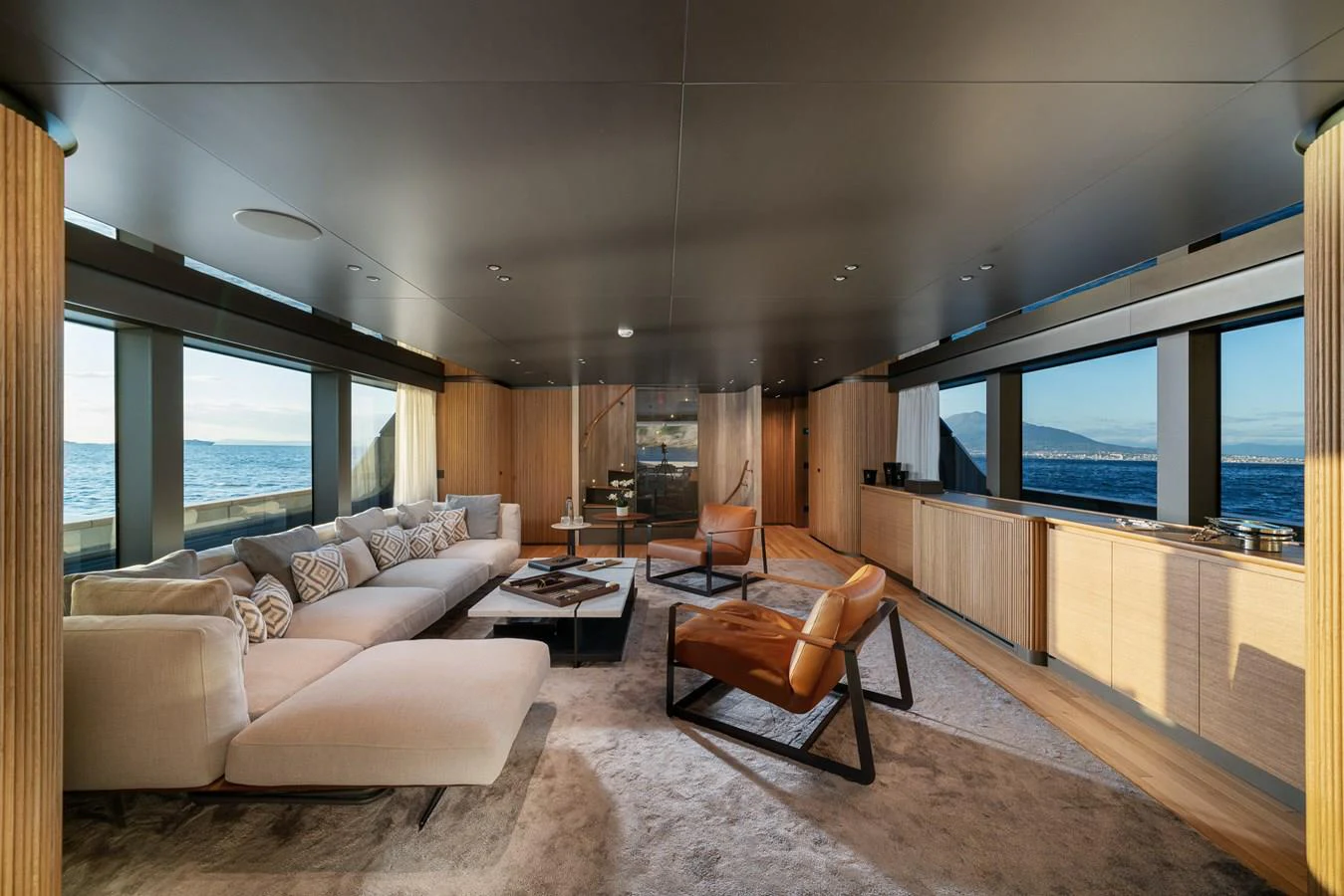 a living room with a large window aboard INVICTUS Yacht for Sale