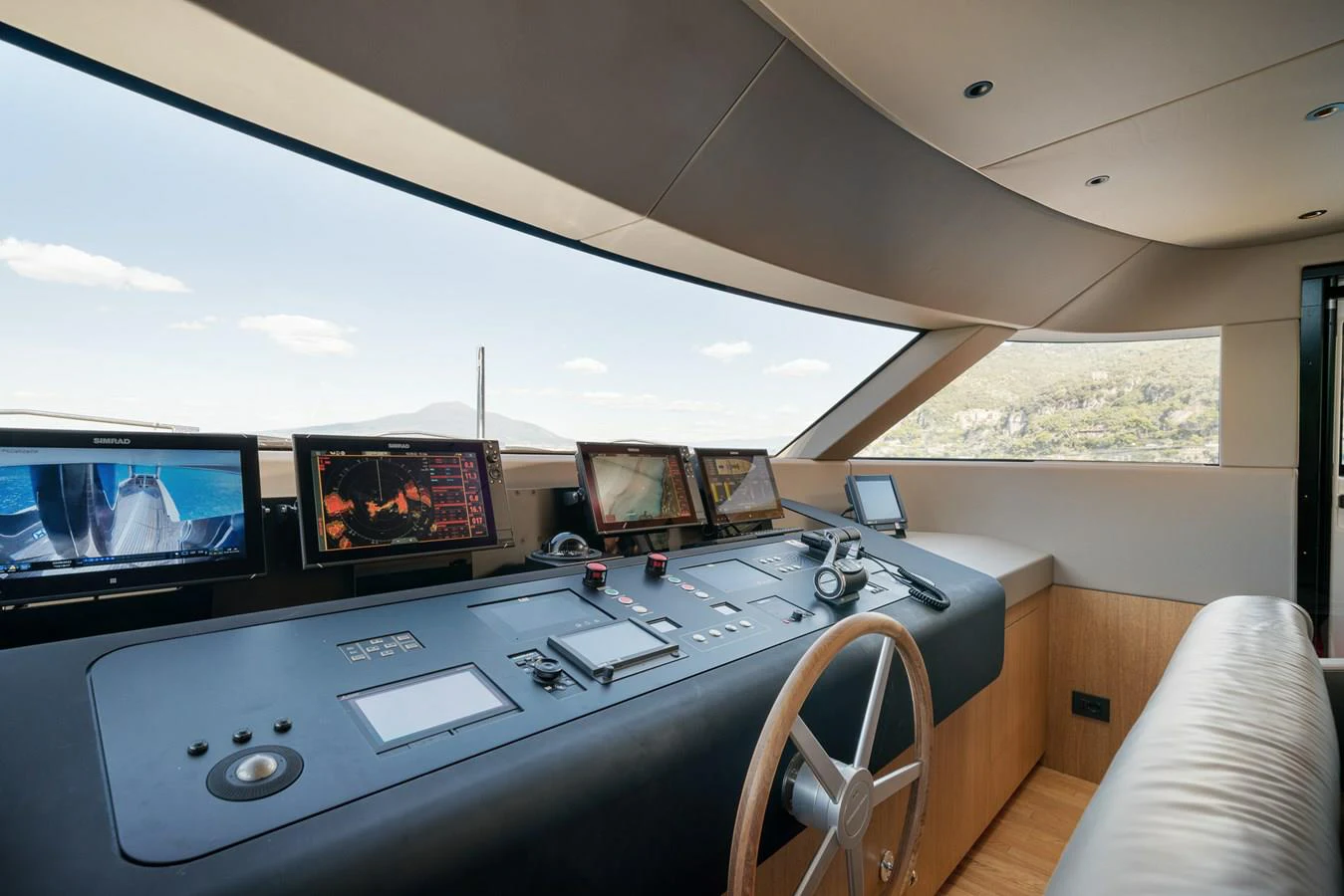 a room with many monitors and laptops on a table aboard INVICTUS Yacht for Sale