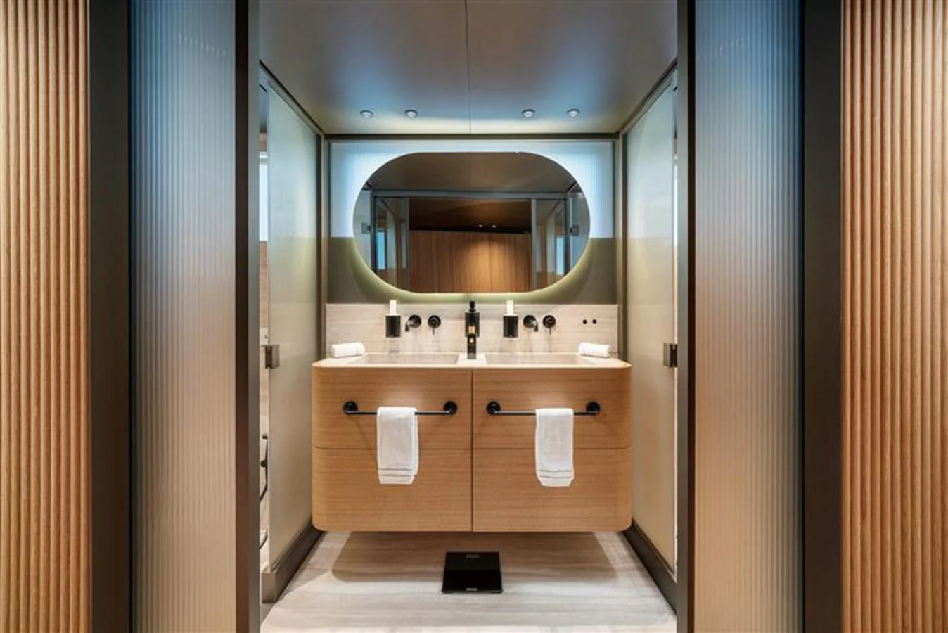 a bathroom with a large mirror aboard INVICTUS Yacht for Sale