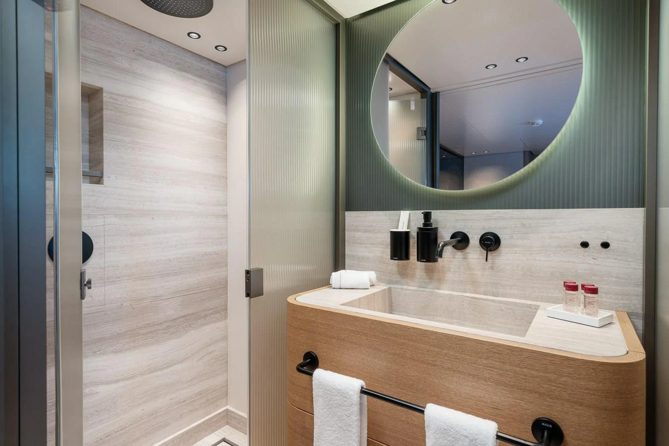 a bathroom with a large mirror aboard INVICTUS Yacht for Sale