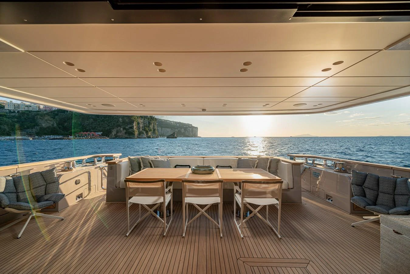 a room with a table and chairs aboard INVICTUS Yacht for Sale