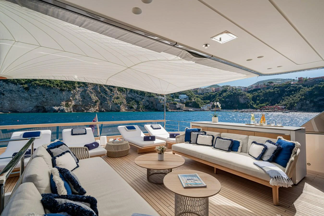 a living room with a large body of water and a large building aboard INVICTUS Yacht for Sale