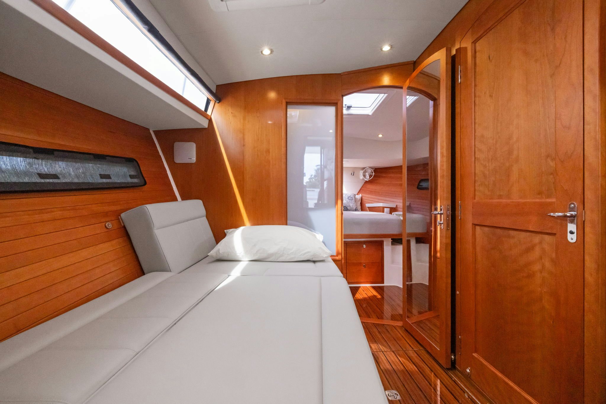 a room with a bed and a mirror aboard ANNABELLE Yacht for Sale