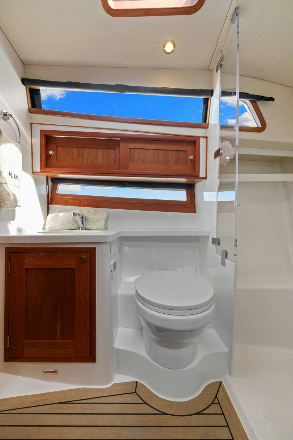 a bathroom with a toilet and a cabinet aboard ANNABELLE Yacht for Sale