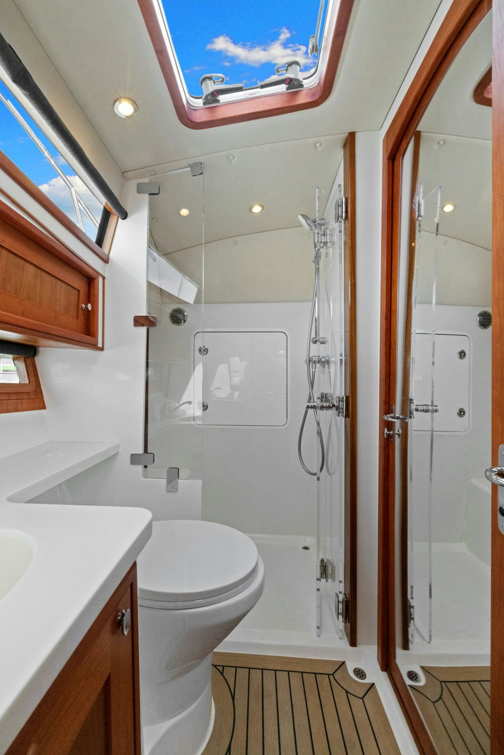 a bathroom with a shower and toilet aboard ANNABELLE Yacht for Sale