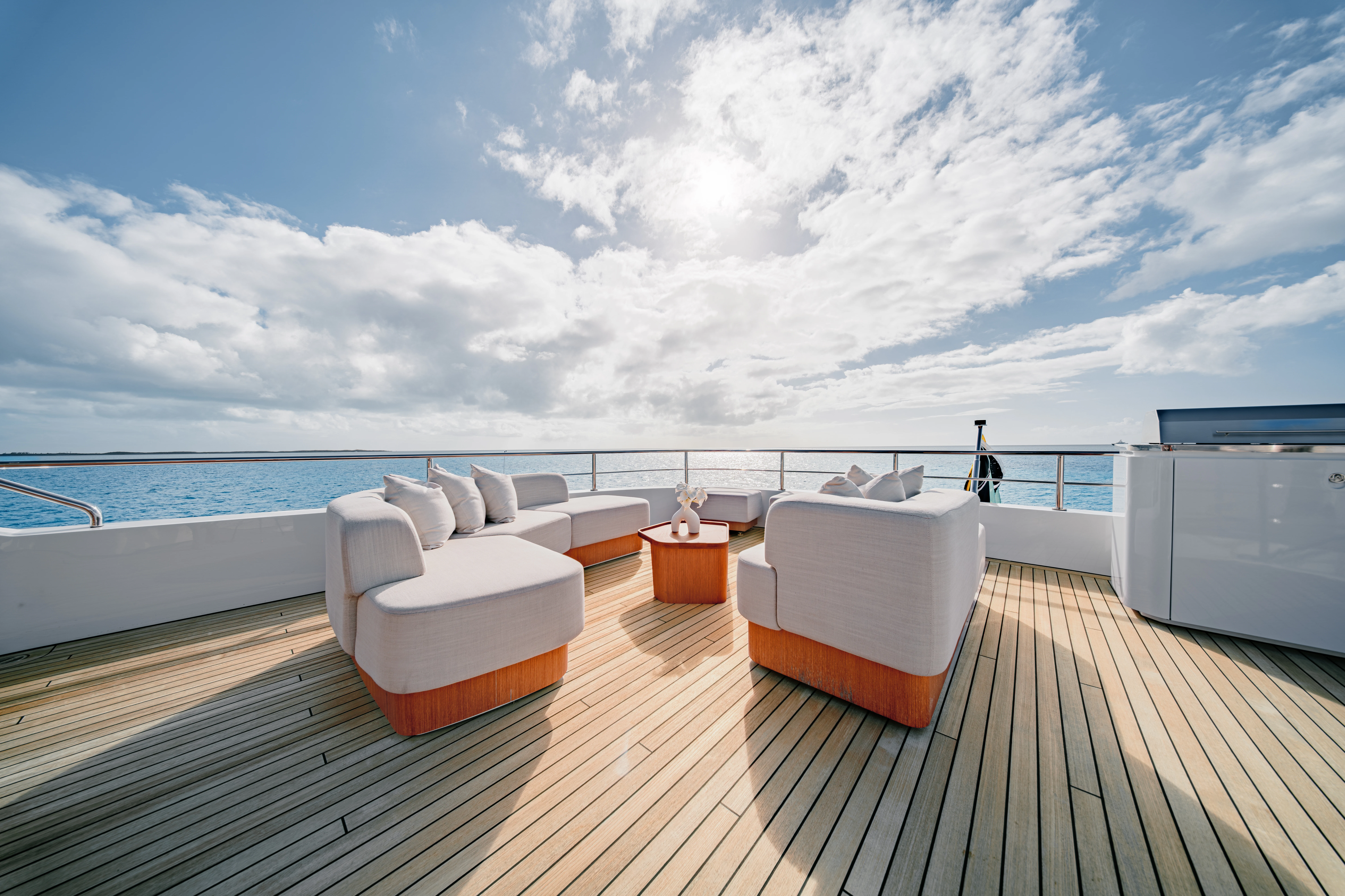 a deck with a view of the ocean and the ocean aboard PROPOSITION Yacht for Charter