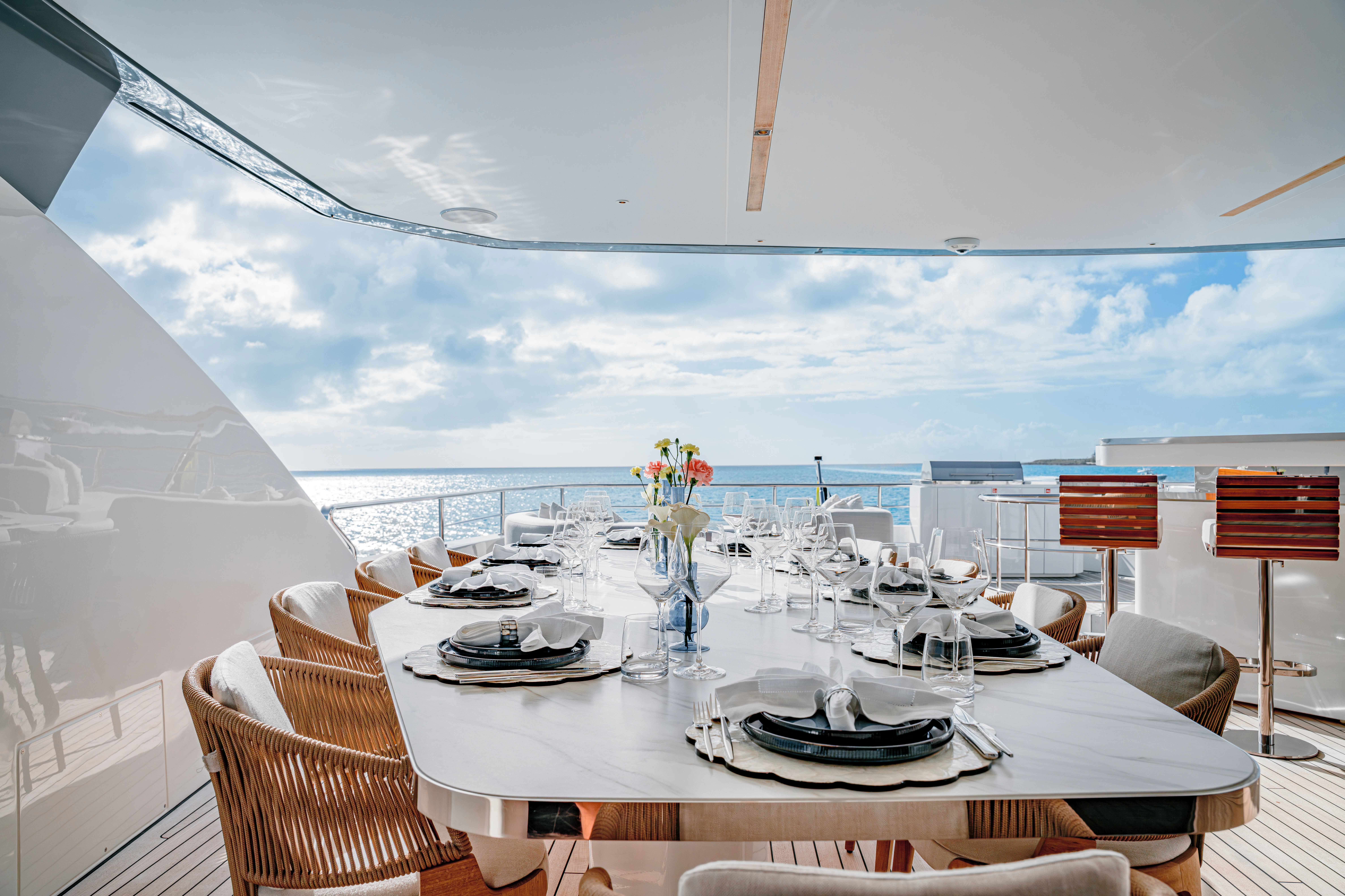 a table set for a dinner aboard PROPOSITION Yacht for Charter