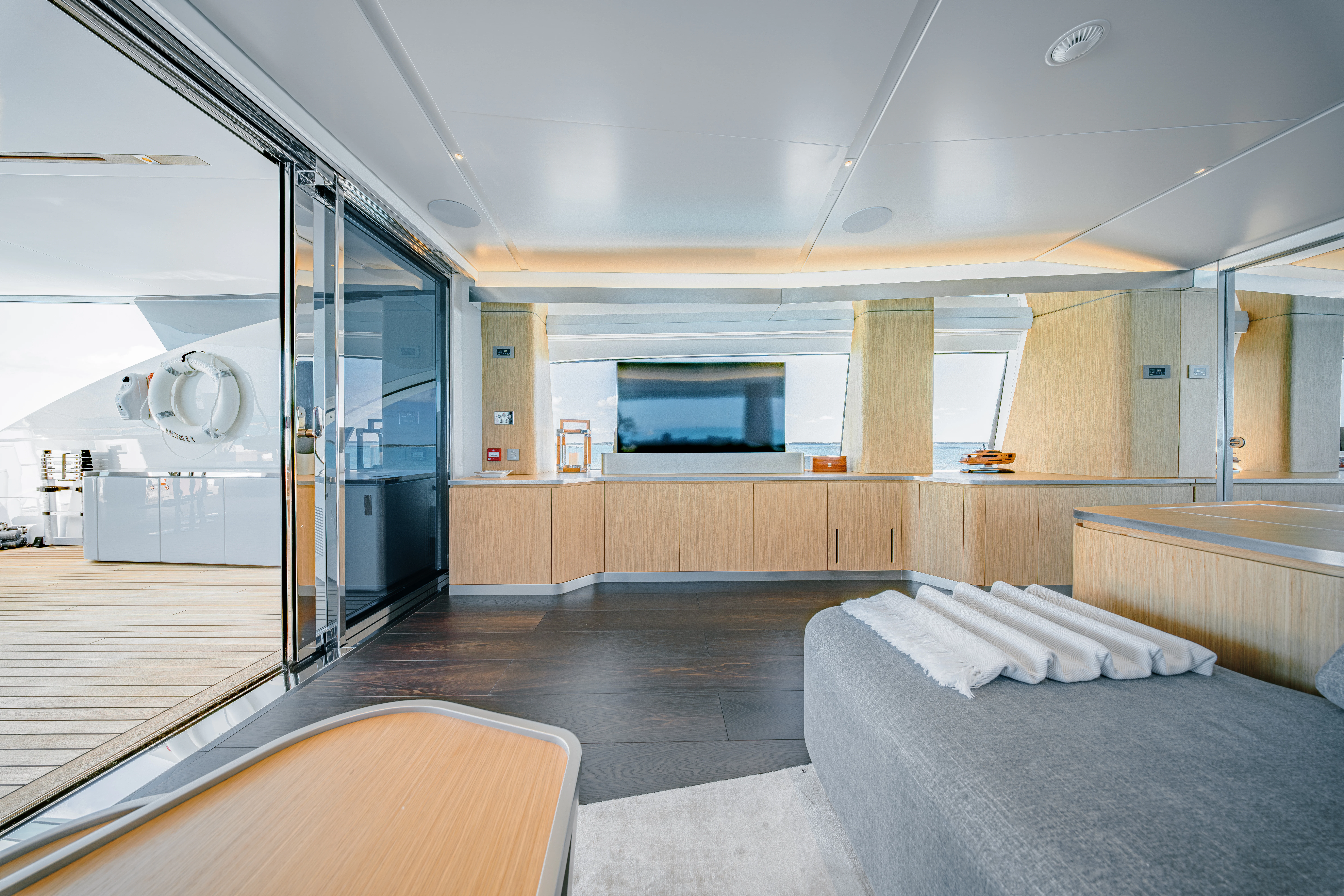 a room with a bed and a tv aboard PROPOSITION Yacht for Charter