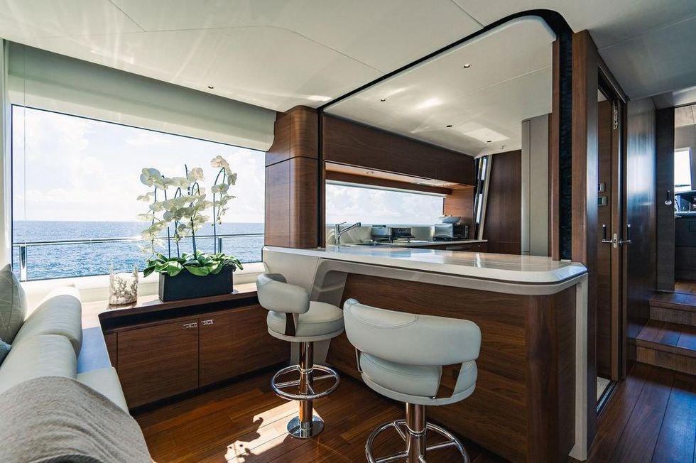 a kitchen with a large window aboard GYPZY Yacht for Charter
